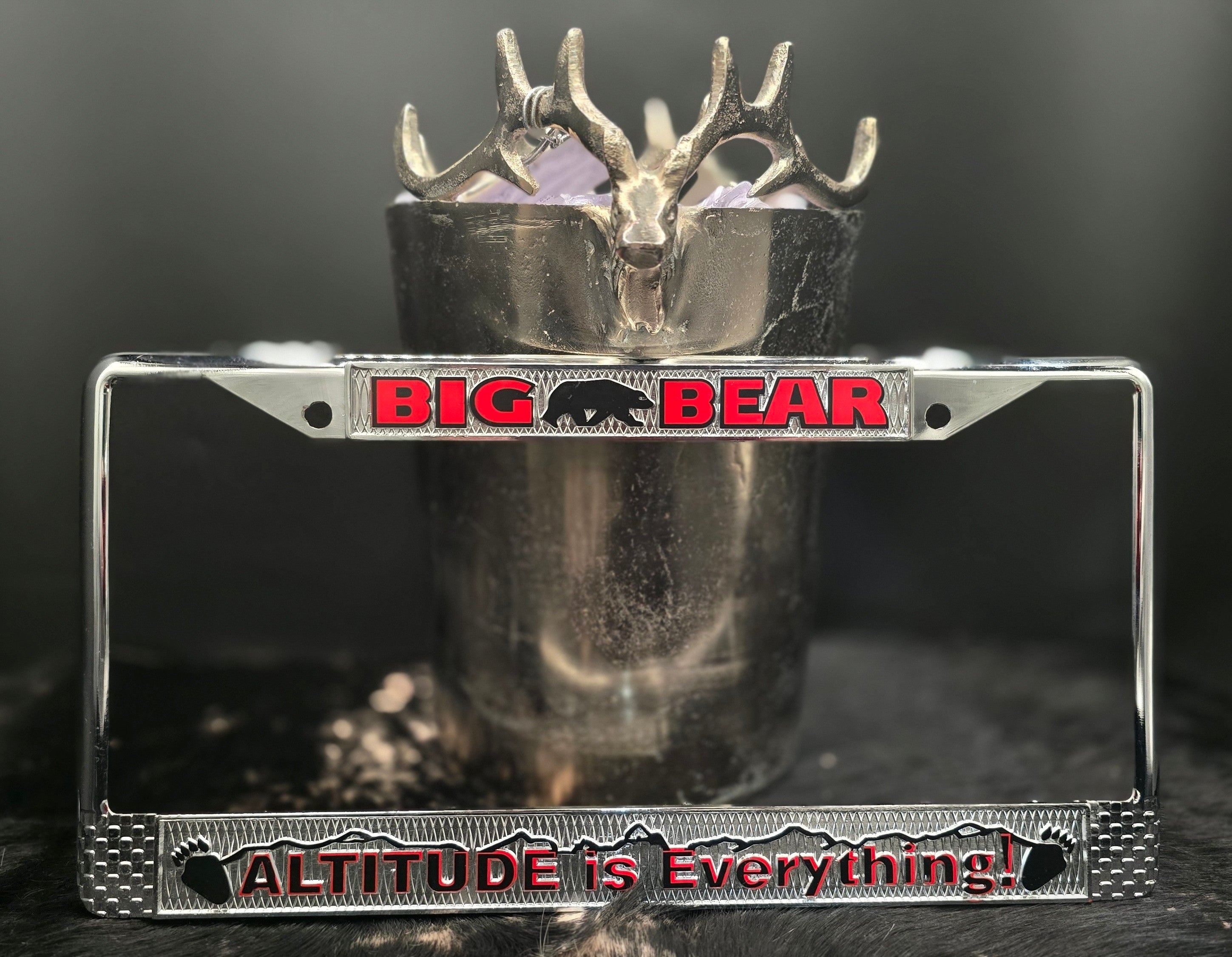 chrome big bear california license plate frame with altitude is everything slogan in red lettering