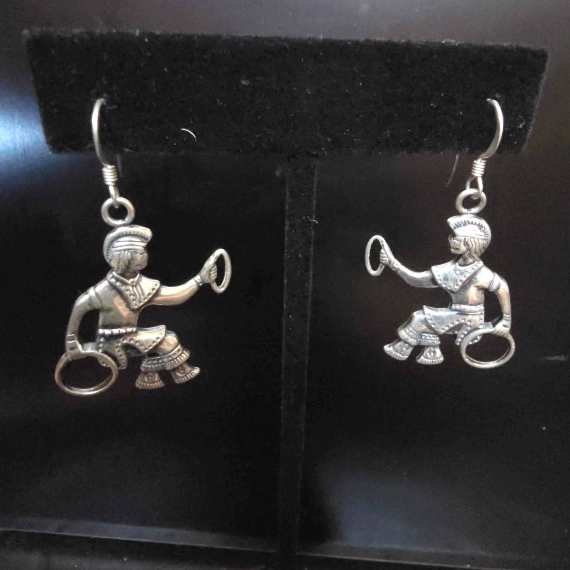 Vintage tested sterling silver Hoop Dancer dangle earrings featuring detailed Southwestern-inspired dancer figures with traditional hoops and fishhook ear wires.