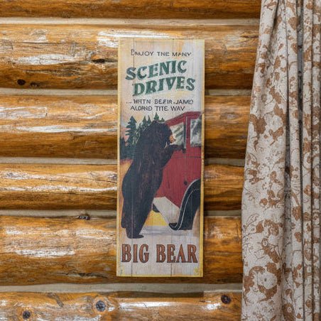 Wooden Plaque Depicting a Large Black Bear Hanging Off of a Red Car "Enjoy the Many Scenic Drives"