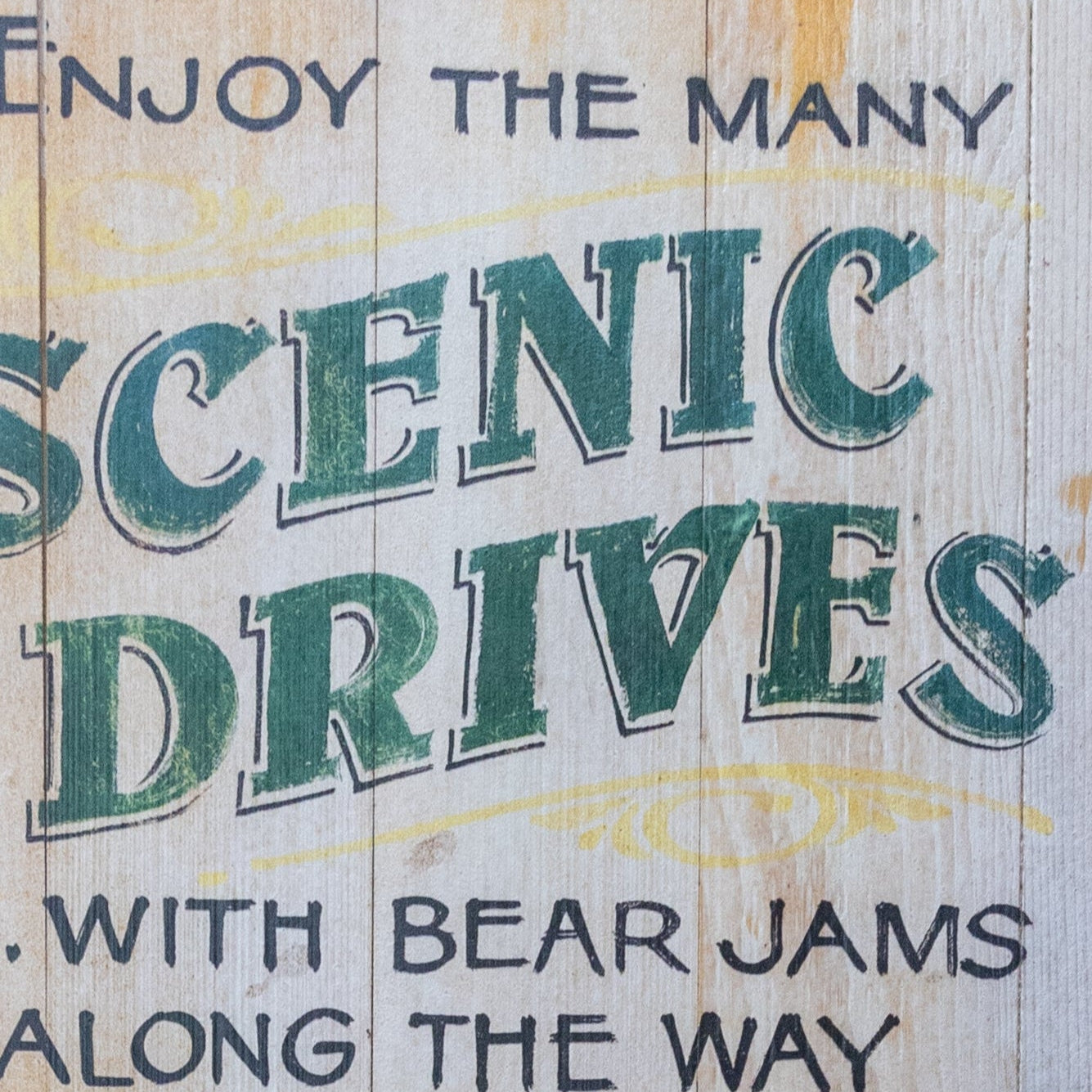 Wooden Plaque Depicting a Large Black Bear Hanging Off of a Red Car "Enjoy the Many Scenic Drives"