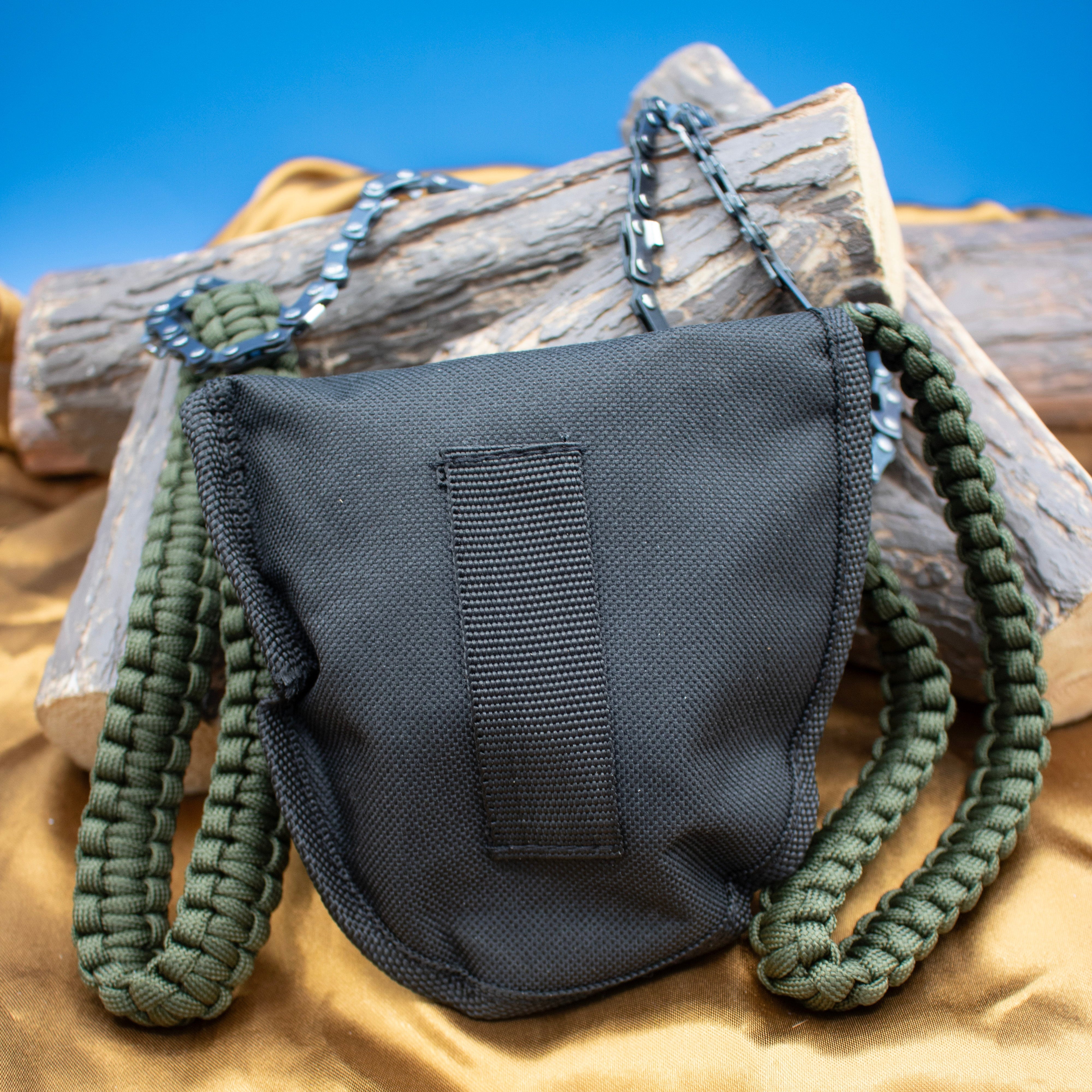 A folding pocket chainsaw with a paracord handle,