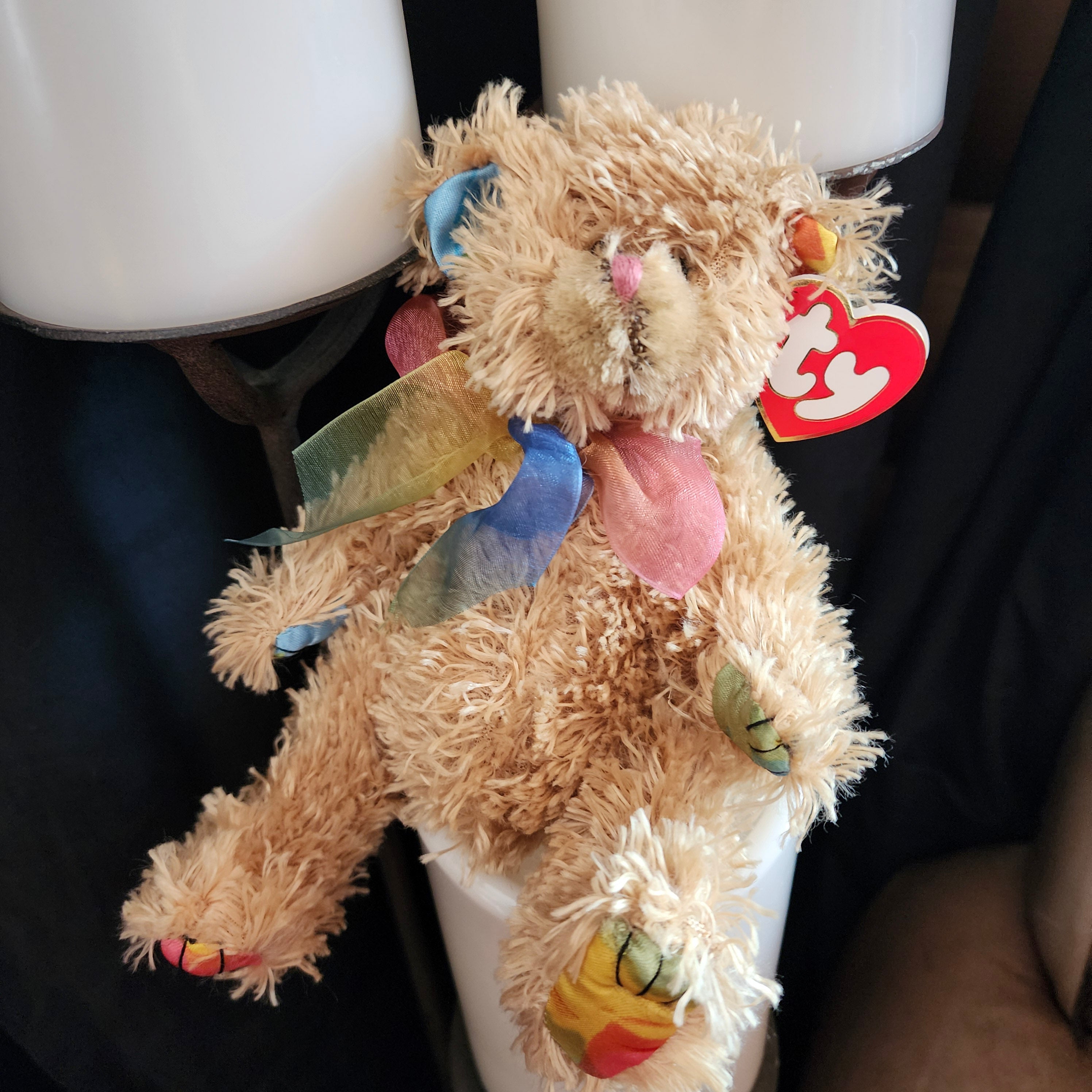 Ty Beanie Baby 'Carmichael the Bear' with multicolored bow and tag, beige fur