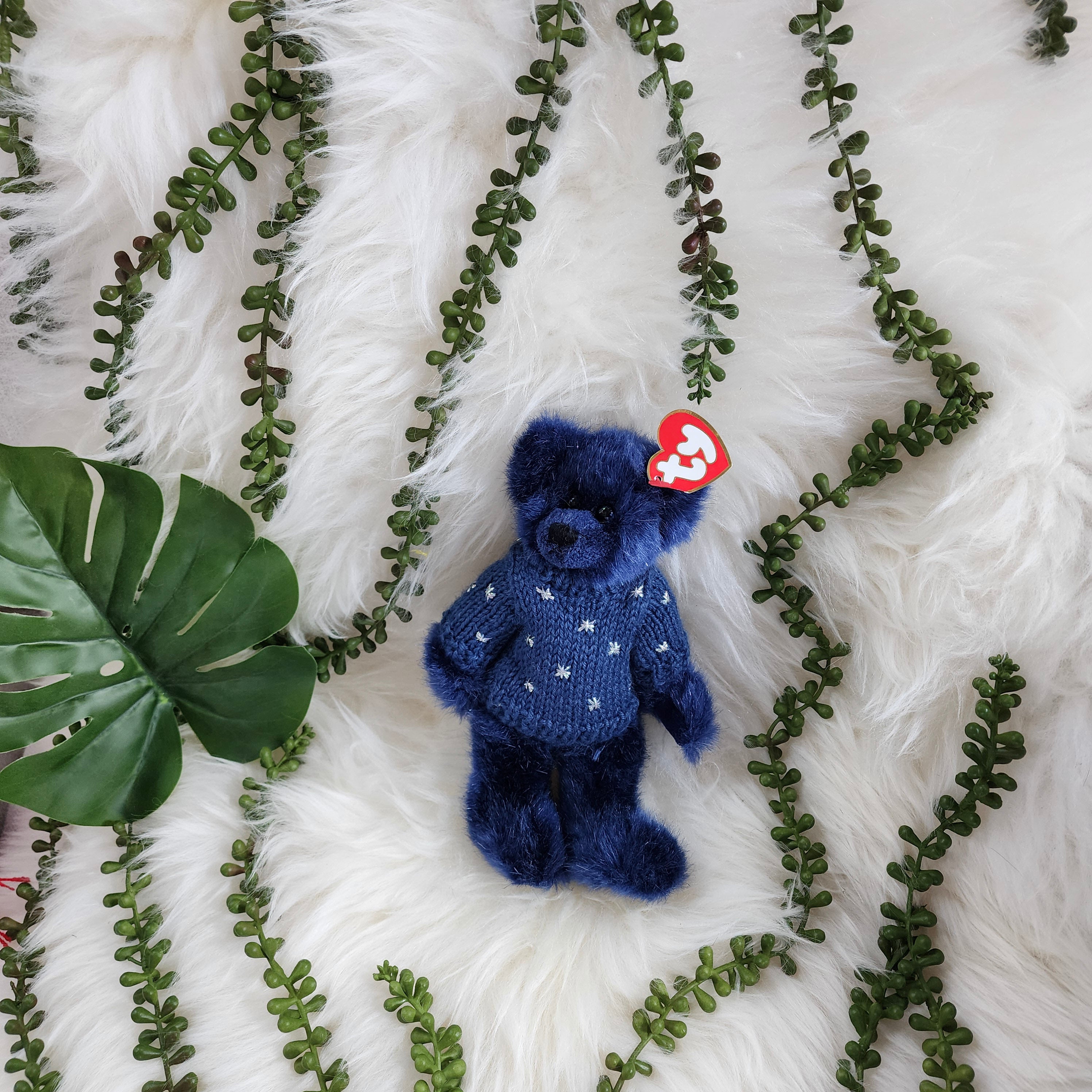 Ty Beanie Babies 'Orion the Bear' plush toy, wearing a blue outfit with a star pattern
