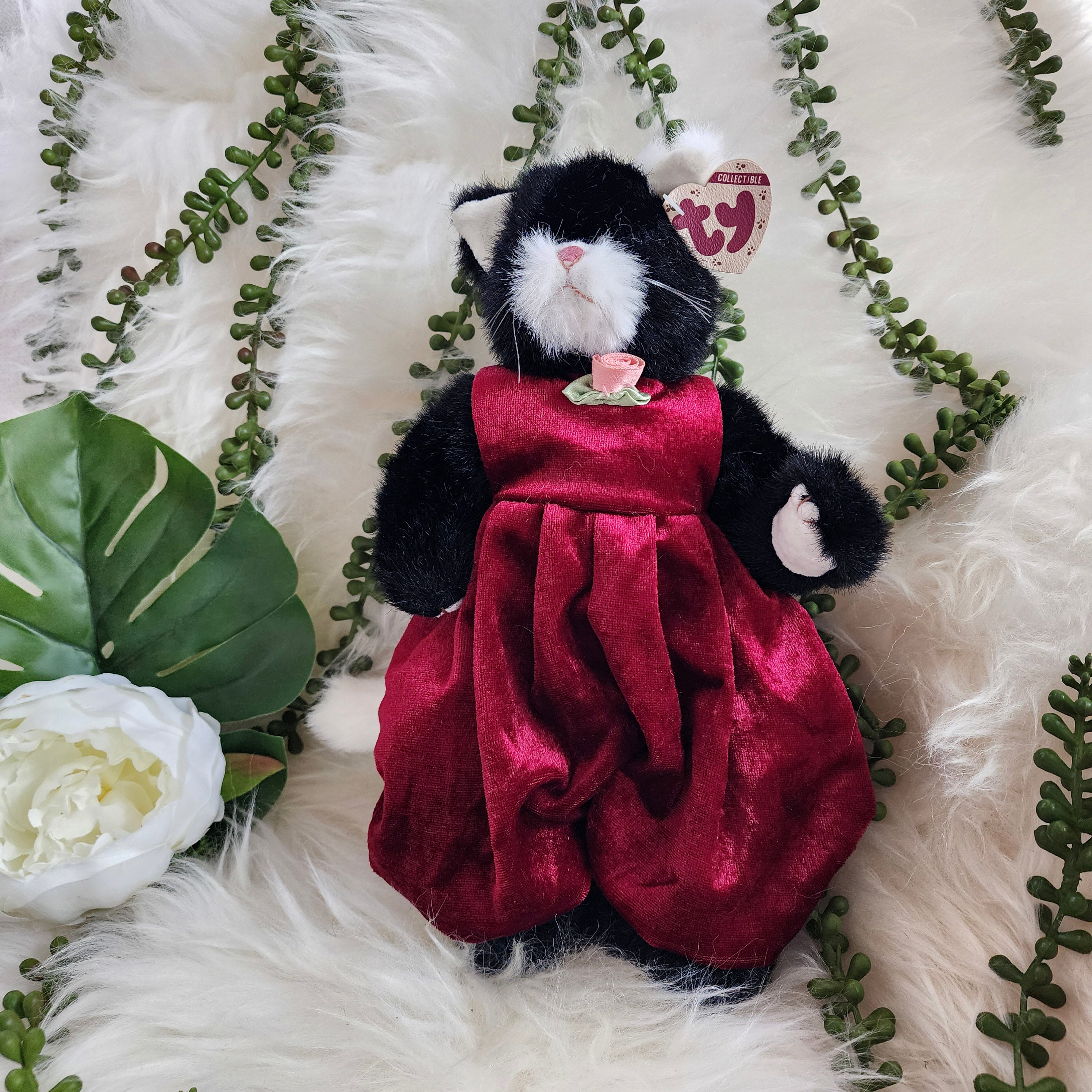 Ty Beanie Babies 'Ebony the Cat' plush toy wearing a red dress