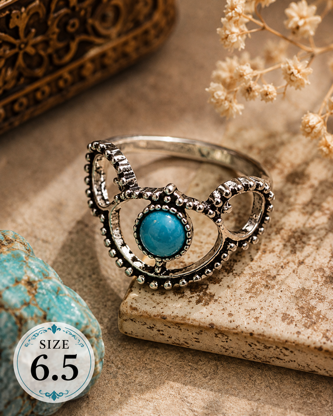 Silver-plated ring featuring a faux turquoise centerpiece surrounded by decorative openwork metalwork and beaded detailing, size 6.5, with Southwestern and bohemian-inspired styling.