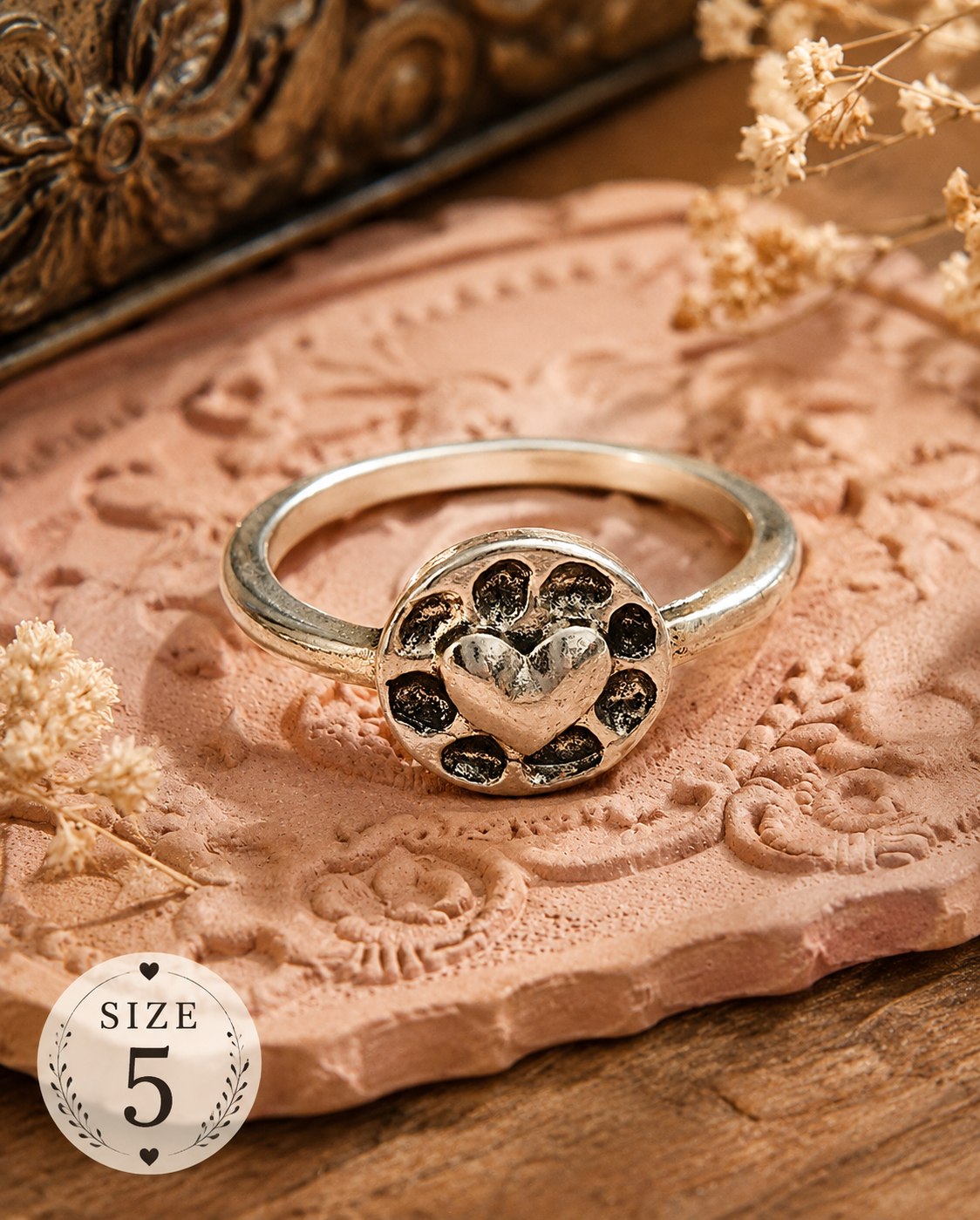 Silver-plated ring featuring a heart-centered paw print design with antiqued detailing, size 5, ideal for pet lovers and animal-themed jewelry collections.