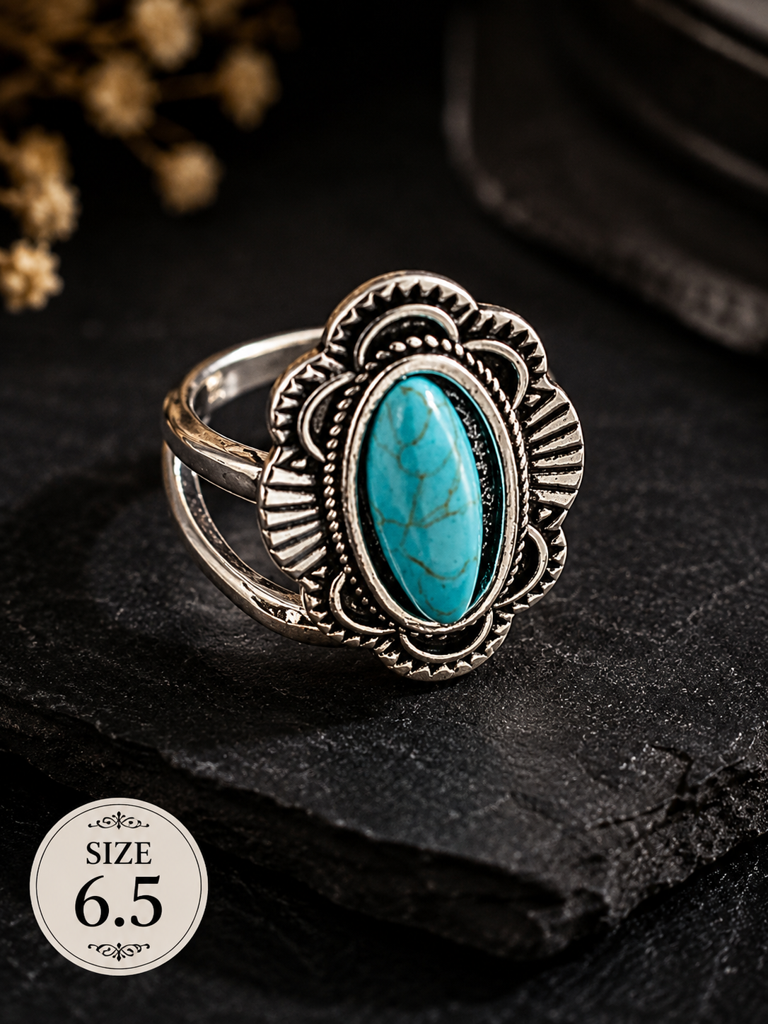 Silver-plated statement ring featuring an oval faux turquoise centerpiece surrounded by intricate decorative detailing, size 6.5, with Southwestern and vintage-inspired styling.
