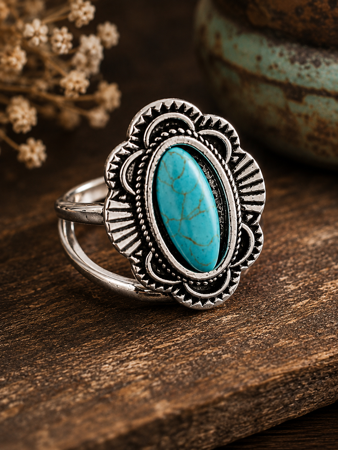 Silver-plated statement ring featuring an oval faux turquoise centerpiece surrounded by intricate decorative detailing, size 6.5, with Southwestern and vintage-inspired styling.