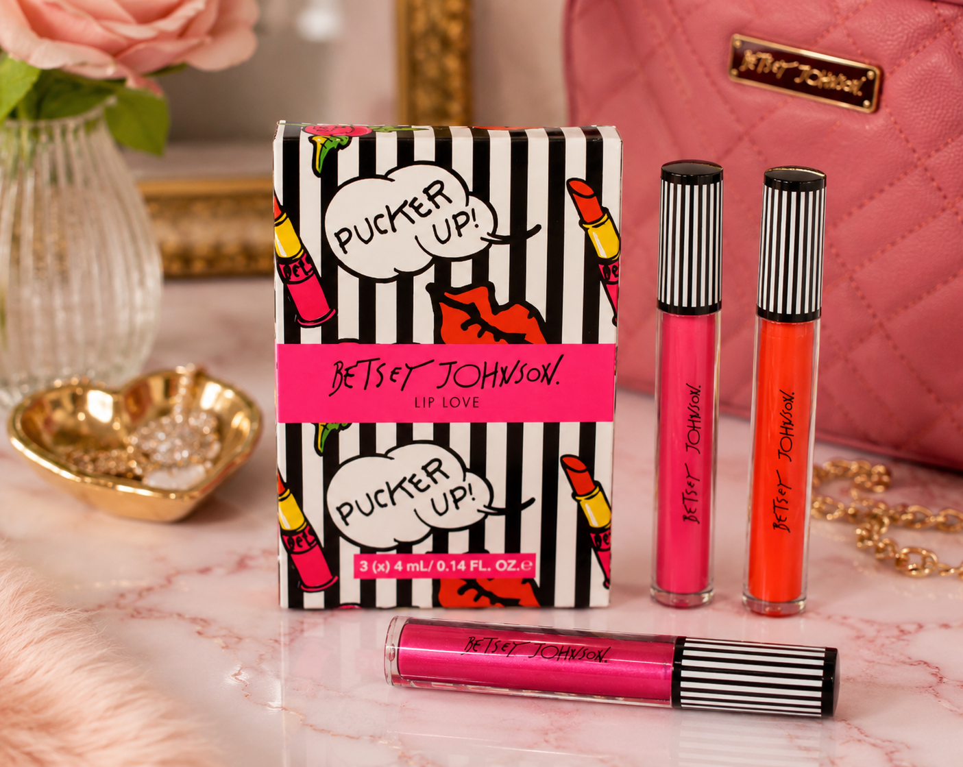 Betsey Johnson Pucker Up Lip Love liquid lip color set featuring three vibrant shades in decorative striped packaging with designer-inspired graphics and collectible gift box.