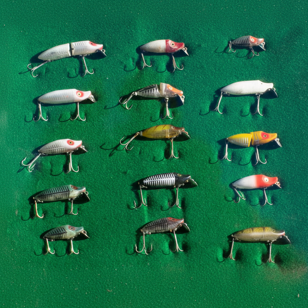 Collection of Fishing Lures Displayed in a Classic Wooden Case