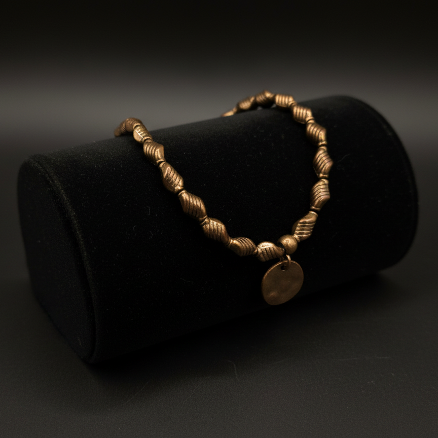 Bronze Colored Beaded Bracelet Featuring a Single Circle Charm