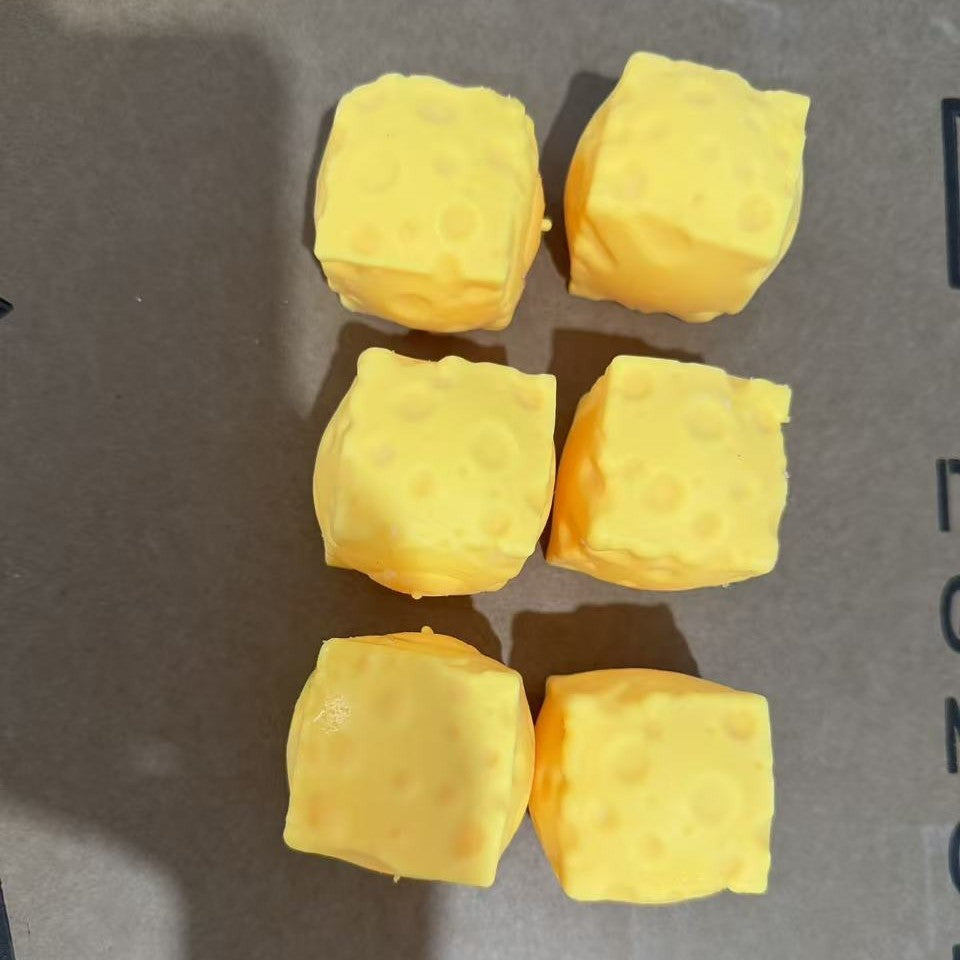 Single yellow Swiss Cheese Squishy Toy with a soft slow-rise texture and realistic cheese-inspired design for sensory play and stress relief.