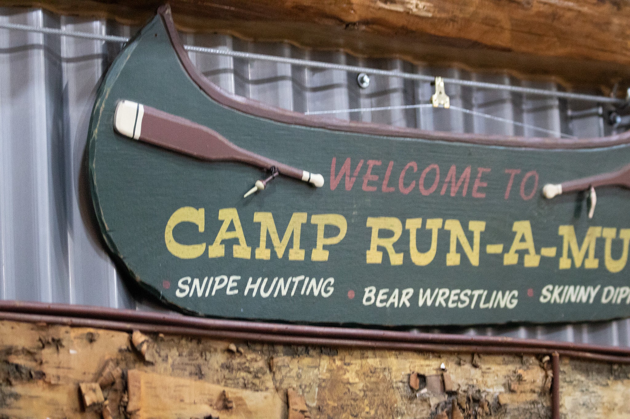 Wooden Green Painted Canoe "Welcome to Camp Run-Muk" Wooden Sign