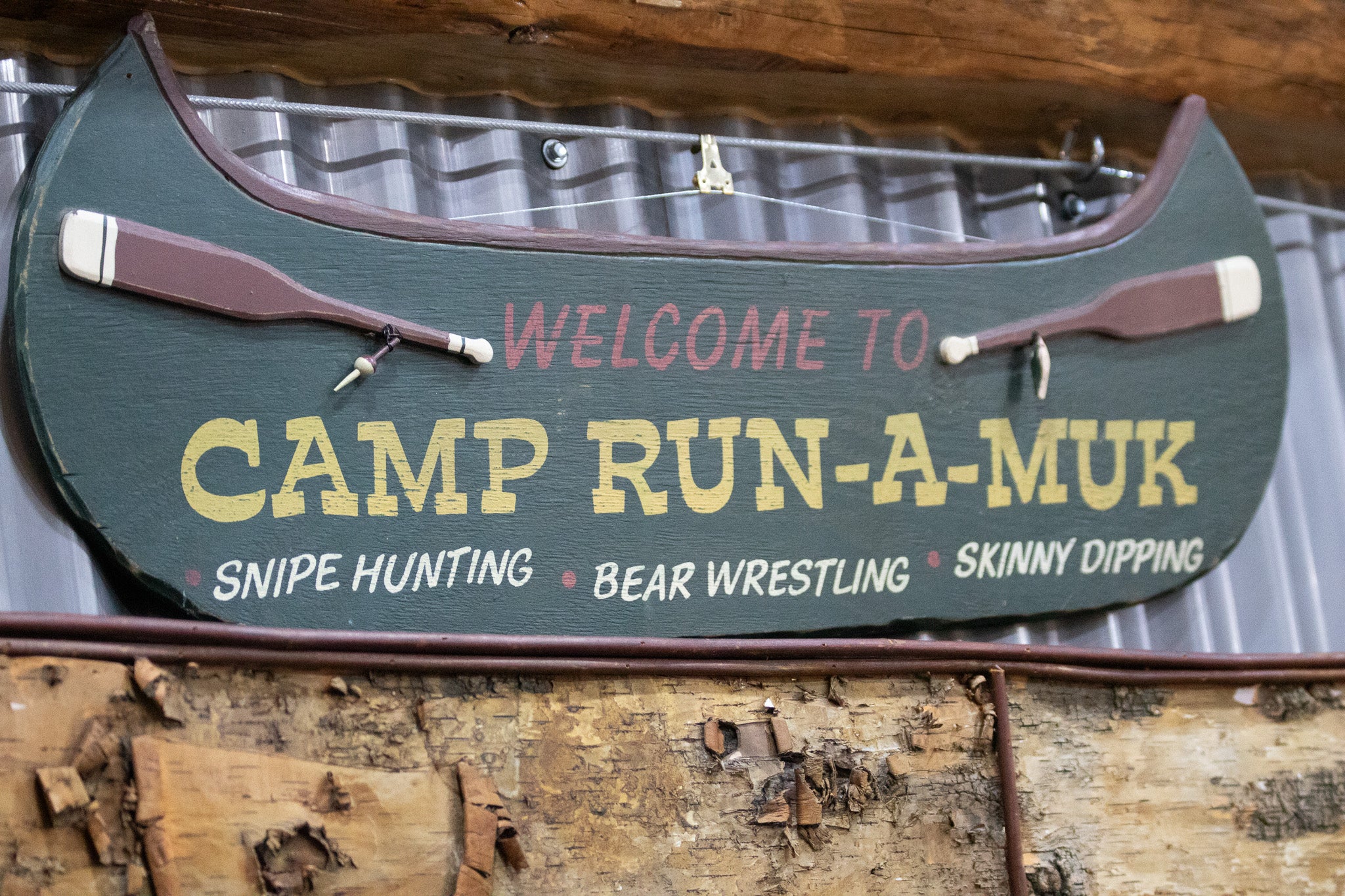 Wooden Green Painted Canoe "Welcome to Camp Run-Muk" Wooden Sign