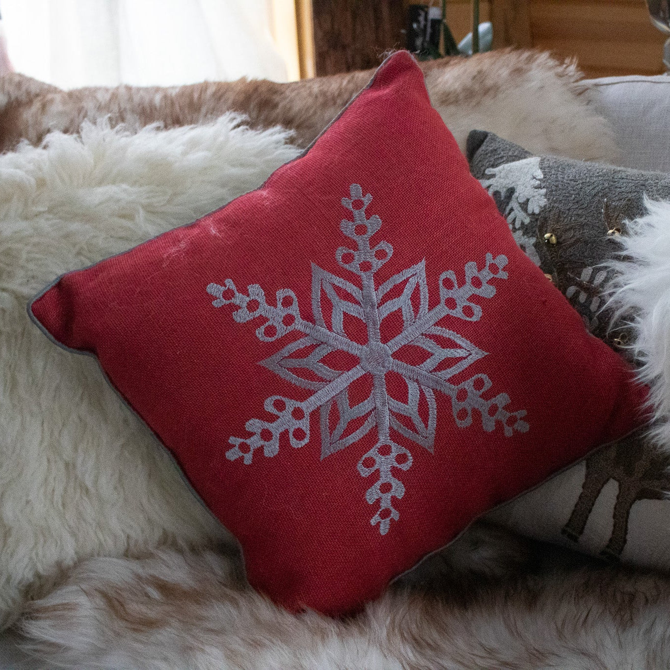 Red Cozy Throw Pillow with Elegant Snowflake Pattern