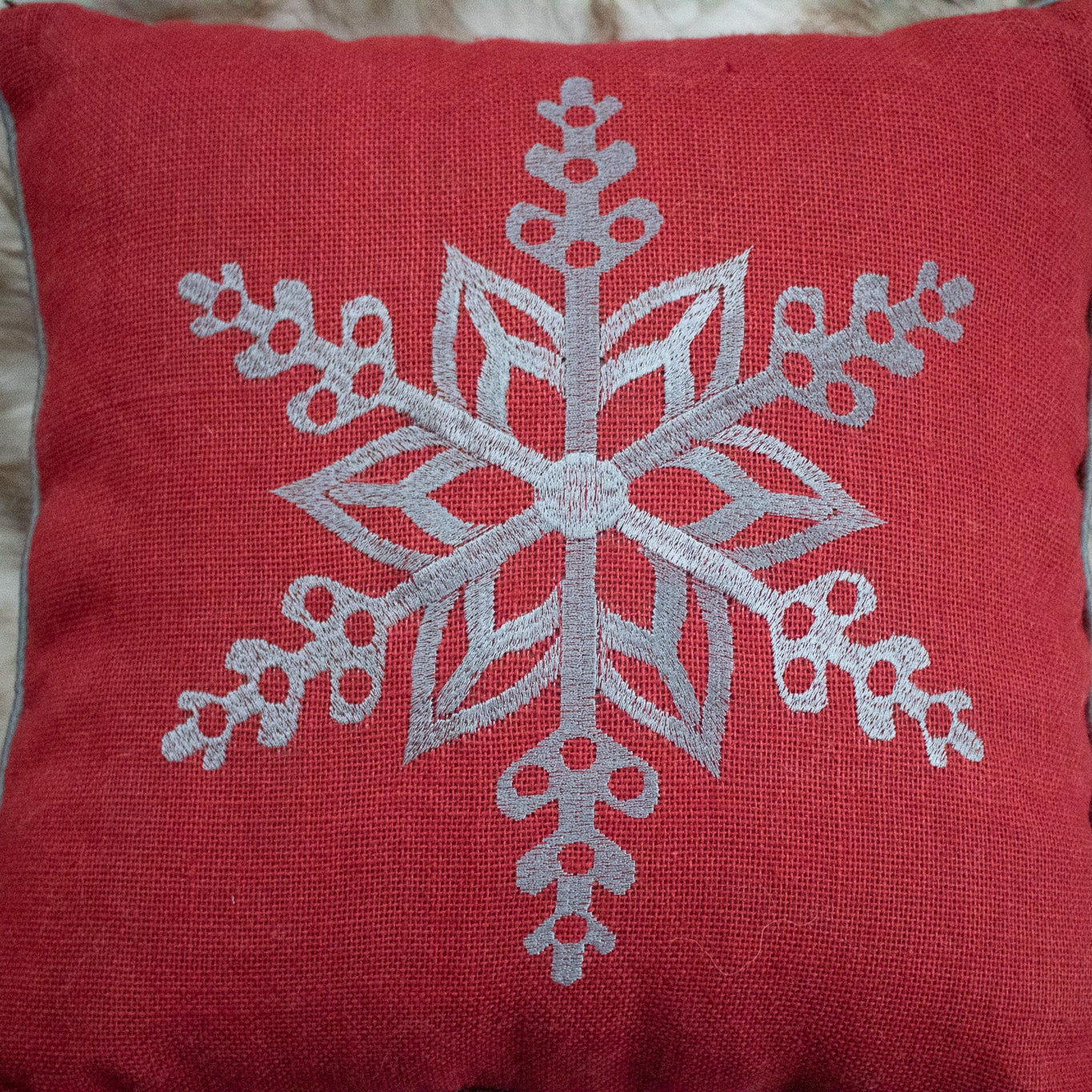 Red Cozy Throw Pillow with Elegant Snowflake Pattern