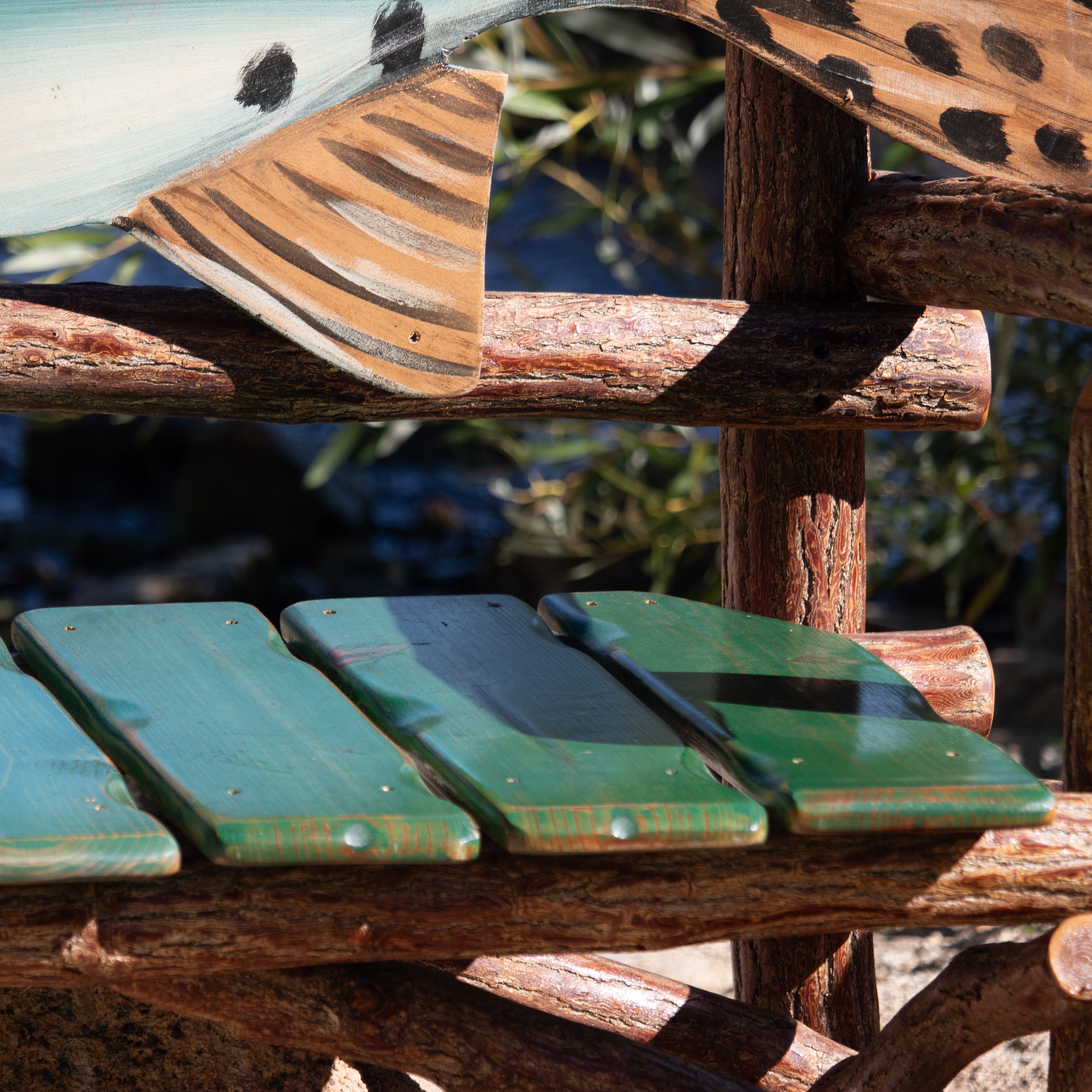 Natural Log Fish Bench Depicting a Realistic Rainbow Trout