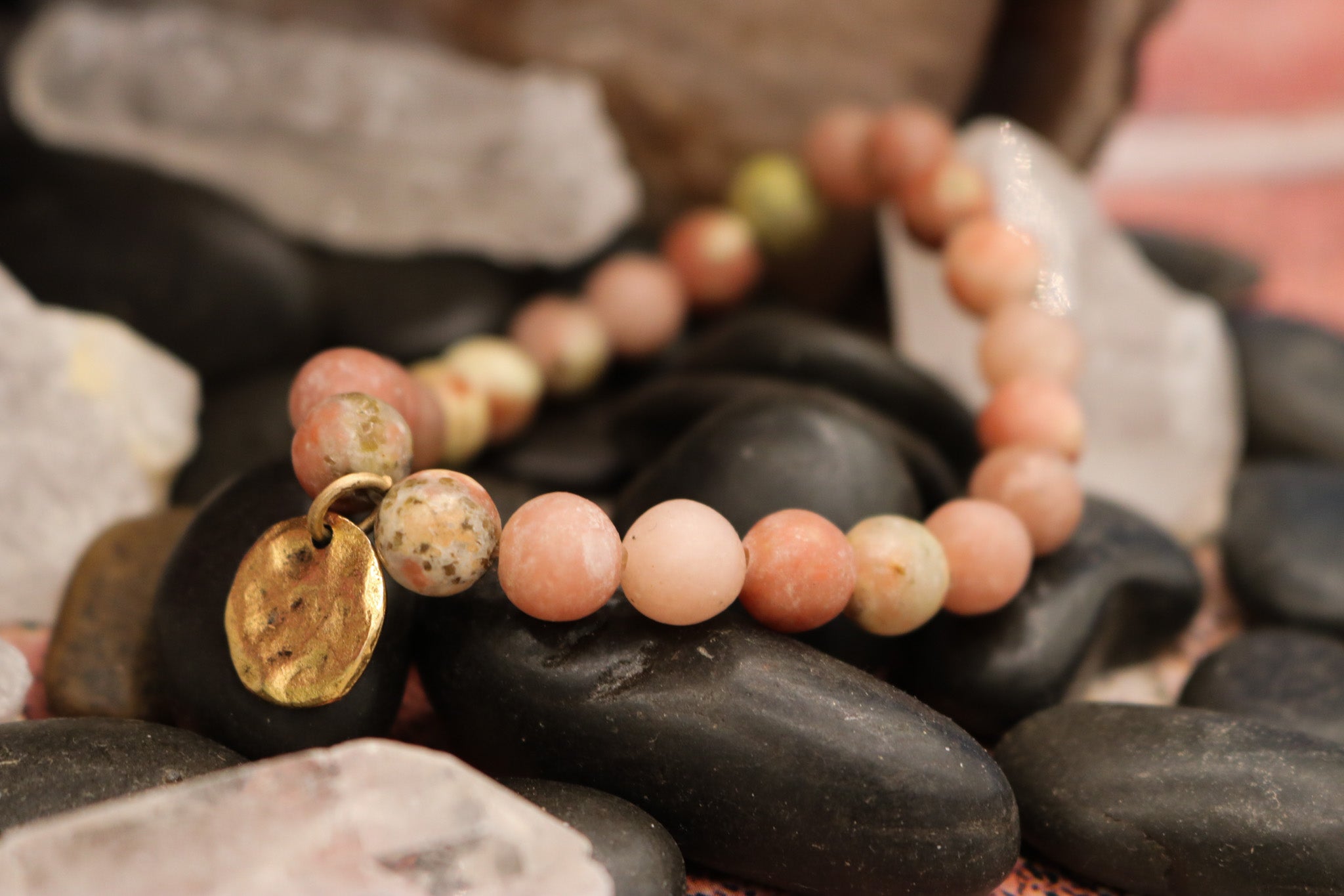Natural Pink Stone Elastic Bracelet Featuring a Gold Charm