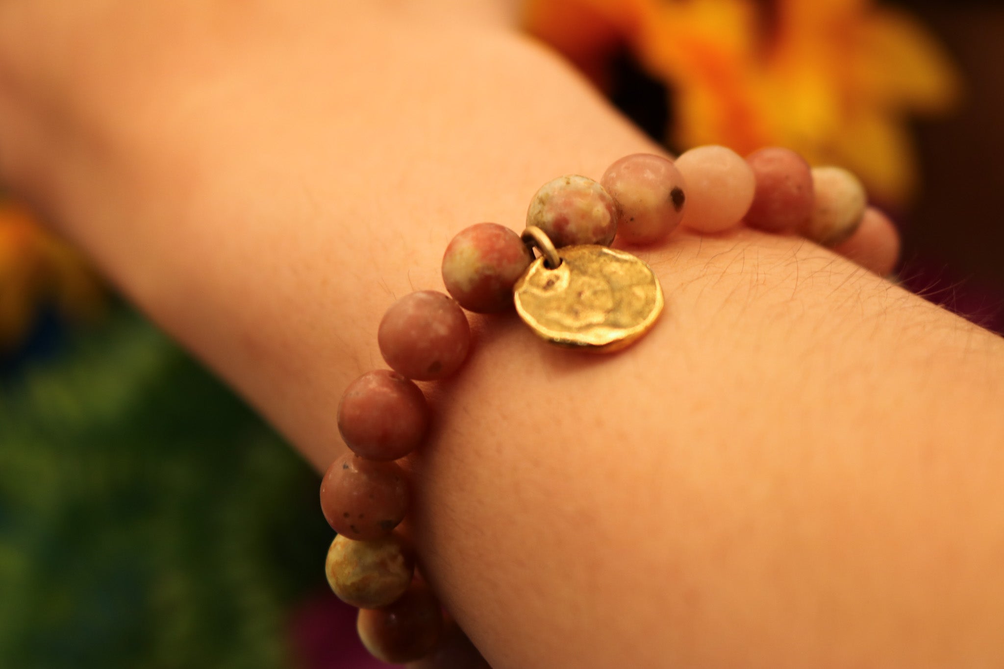 Natural Pink Stone Elastic Bracelet Featuring a Gold Charm