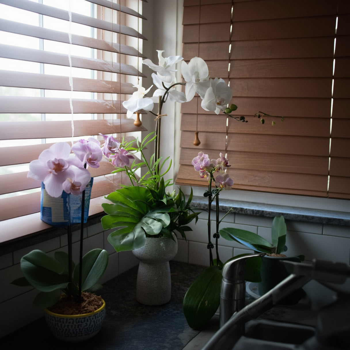 Elegant House Garden Faux White Orchid with Lush Greenery in Stylish Ceramic Vase
