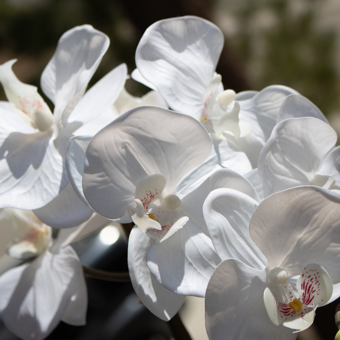 Elegant House Garden Faux White Orchid with Lush Greenery in Stylish Ceramic Vase