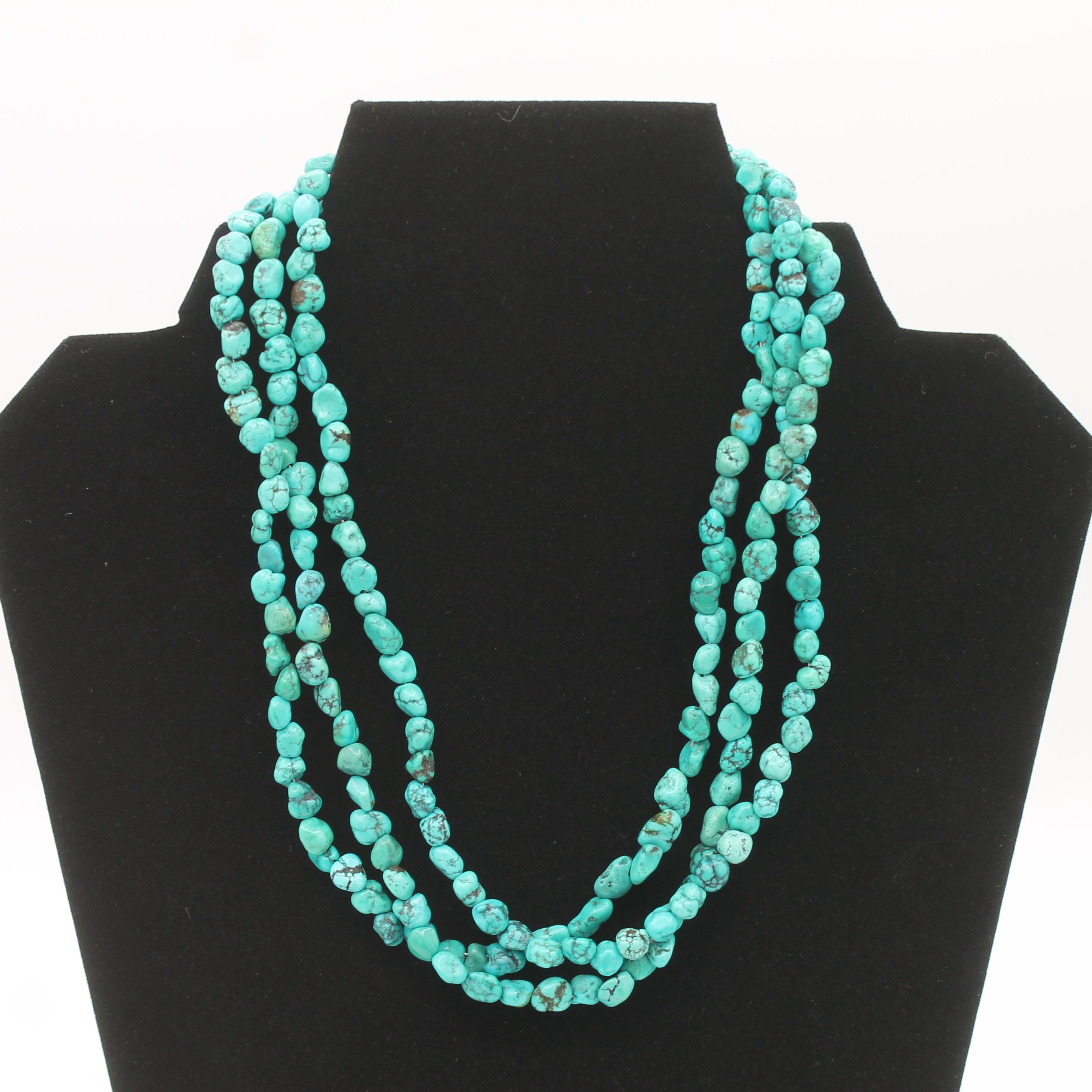 Vintage Navajo Turquoise Nugget Triple Strand Necklace with a Sterling Silver Toggle Clasp.