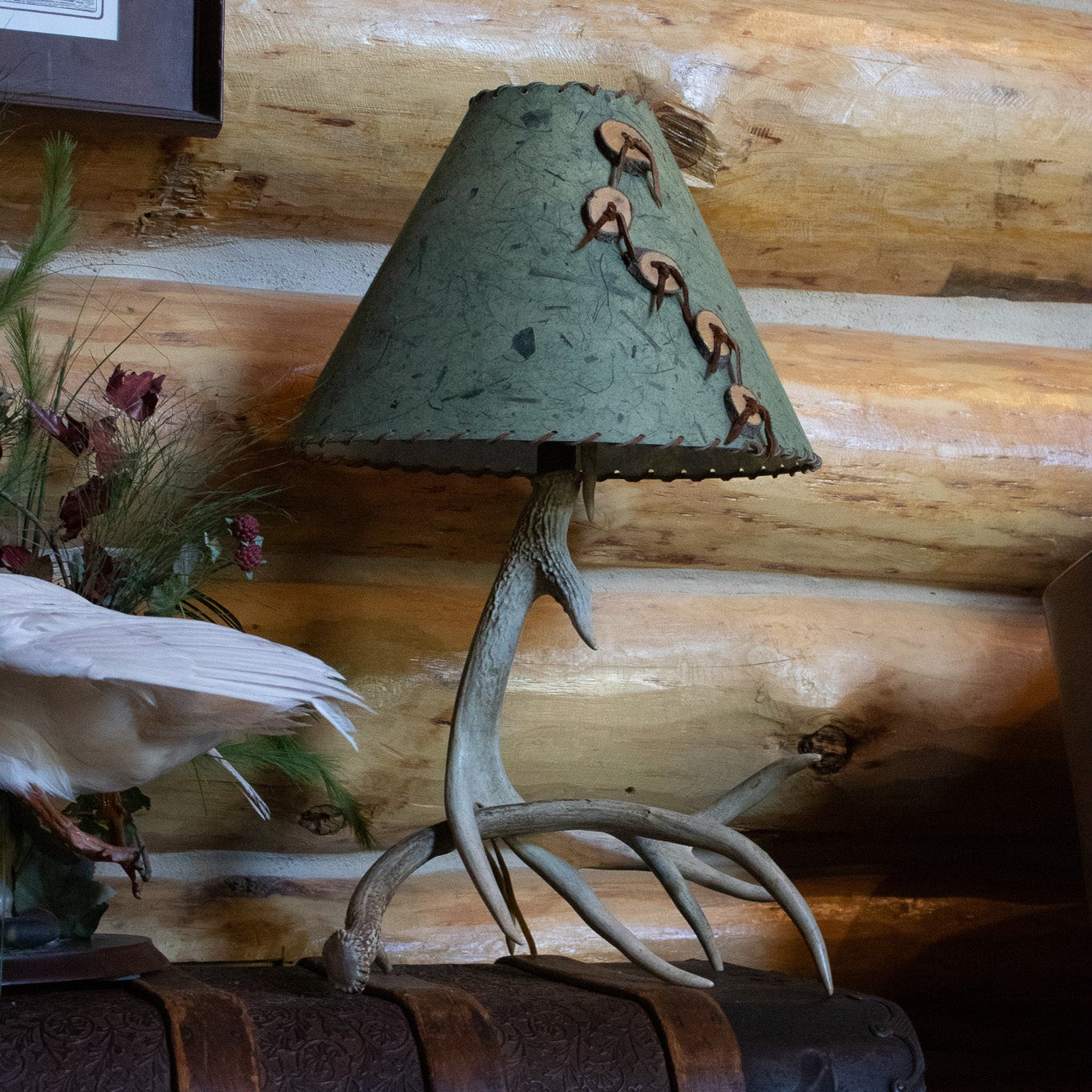 Classic Elk Horn Lamp Complemented by a Green Patterned Shade