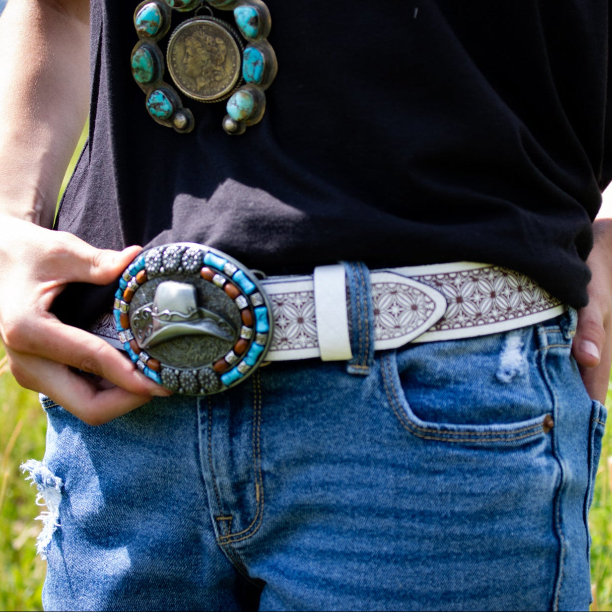 Western Cowboy Hat-themed Belt Buckle on a Engraved White Leather Belt Band