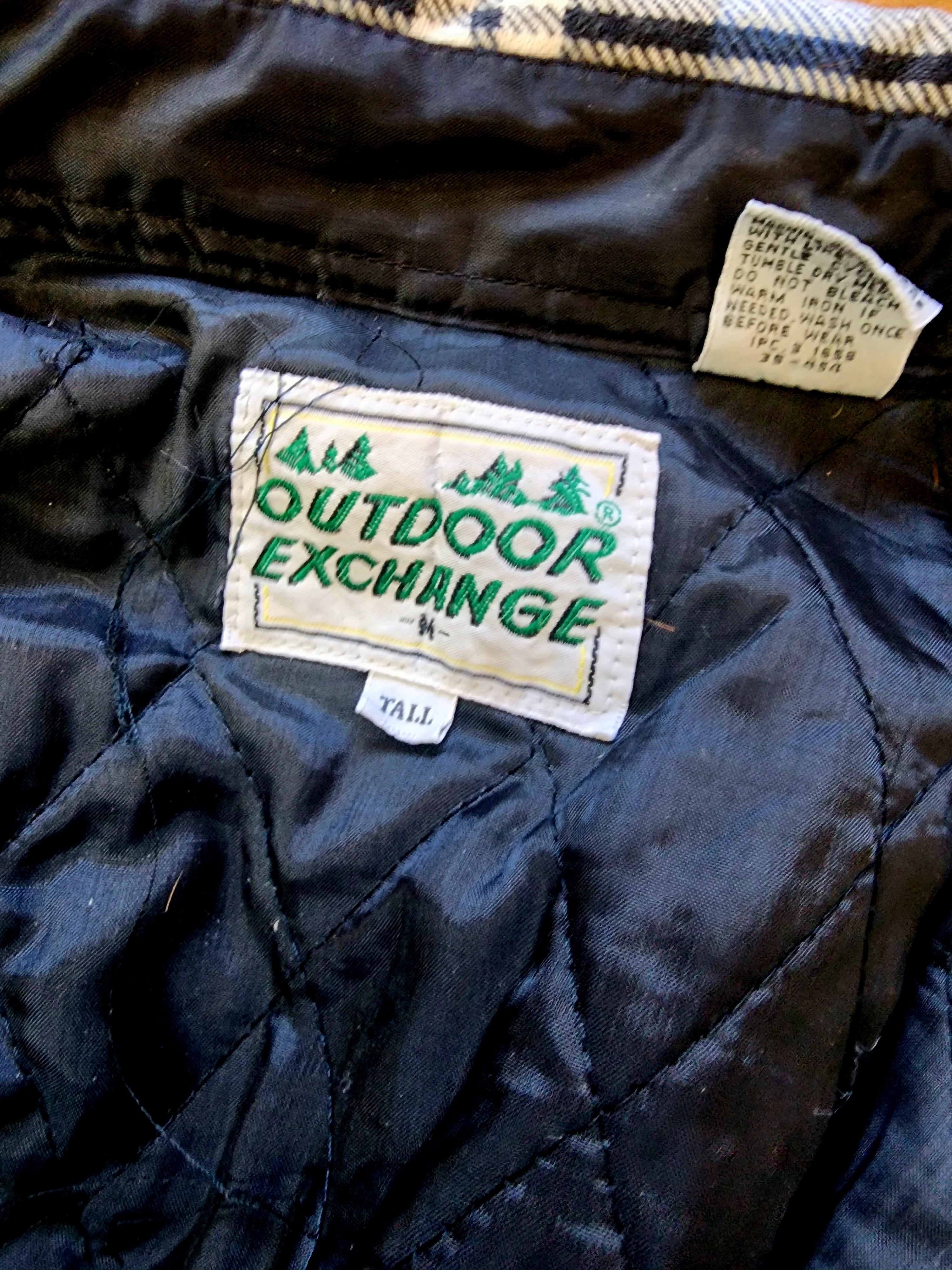 Outdoor Exchange Blue, Black, and White Plaid