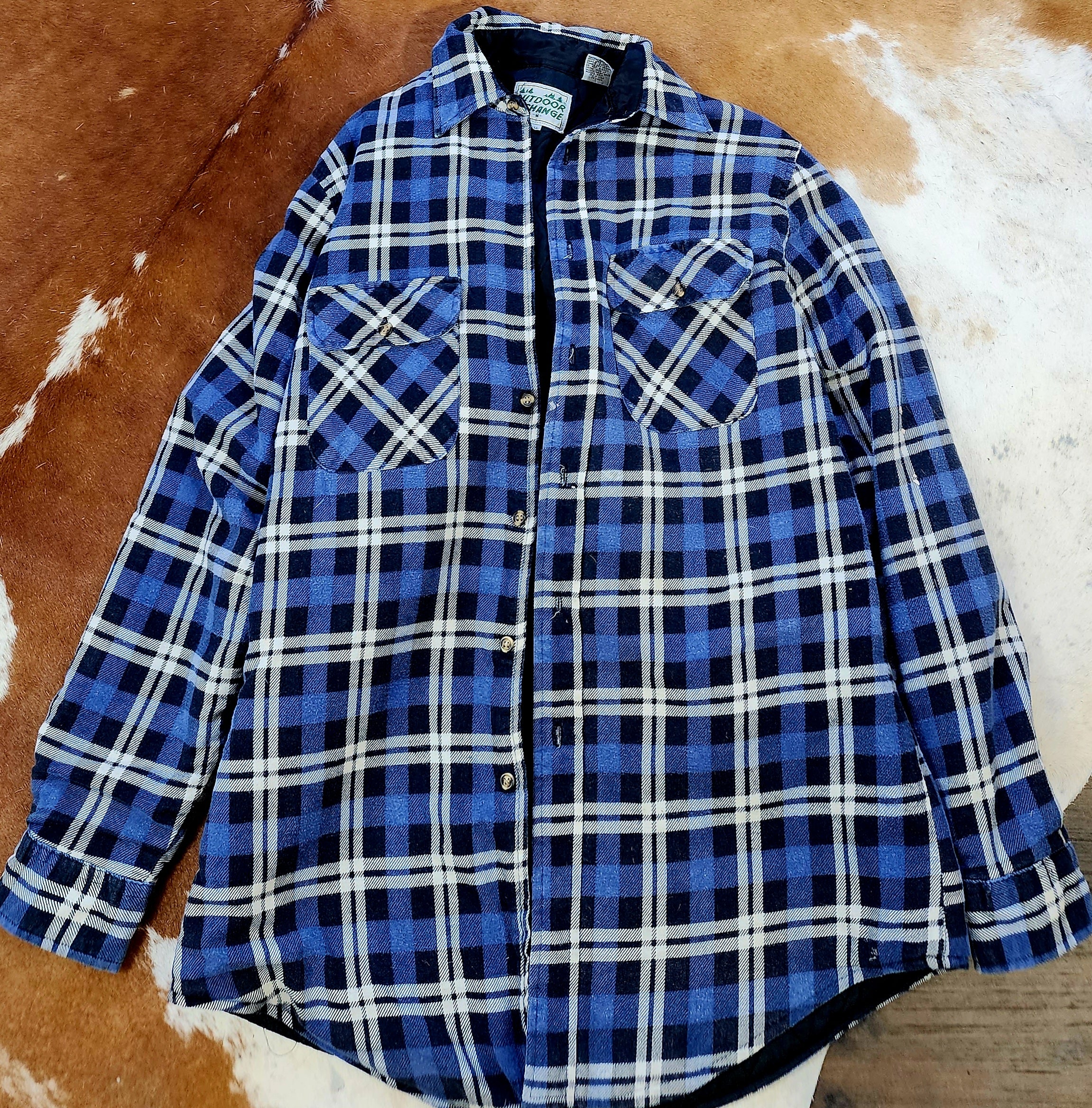 Outdoor Exchange Blue, Black, and White Plaid