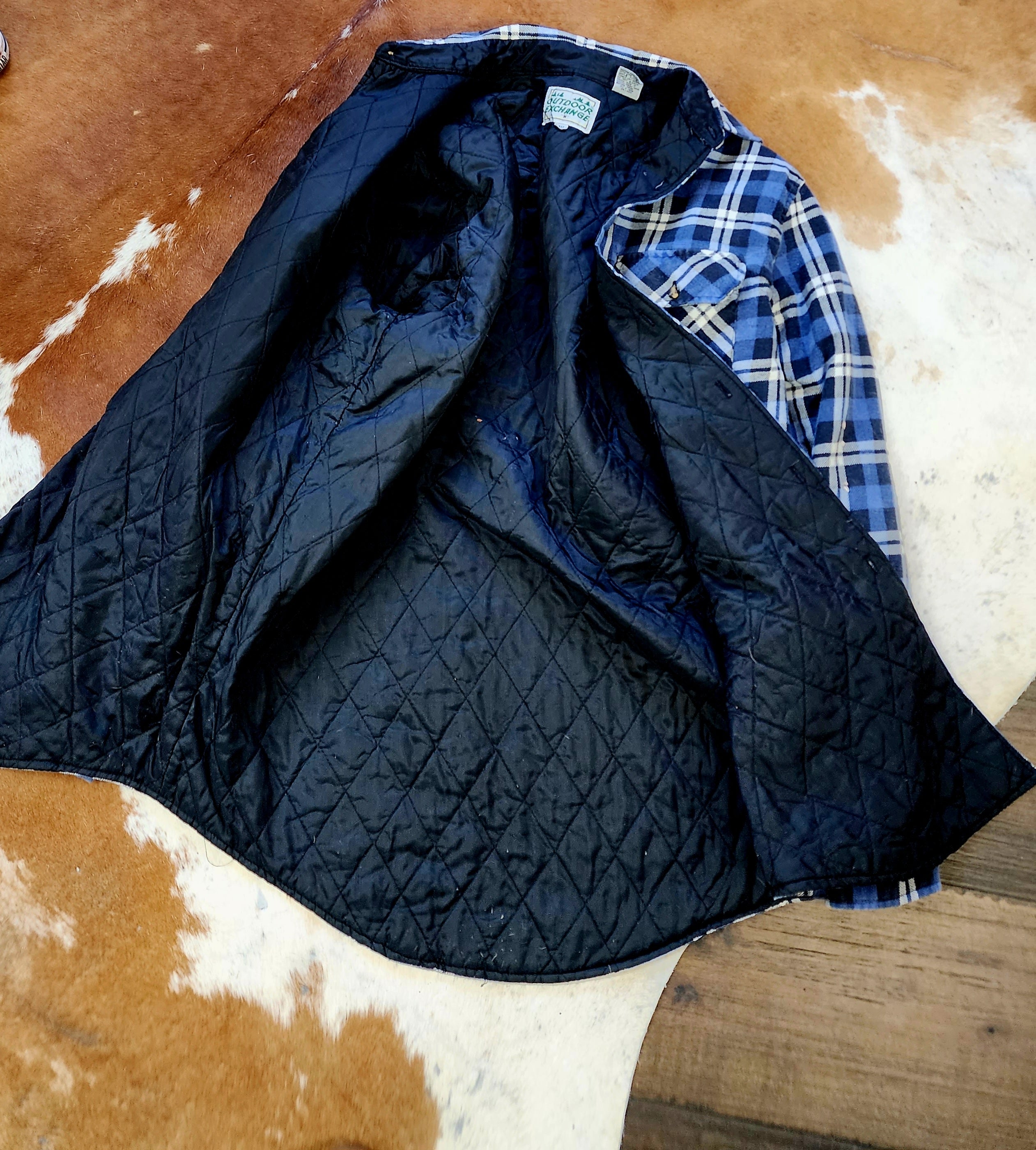 Outdoor Exchange Blue, Black, and White Plaid