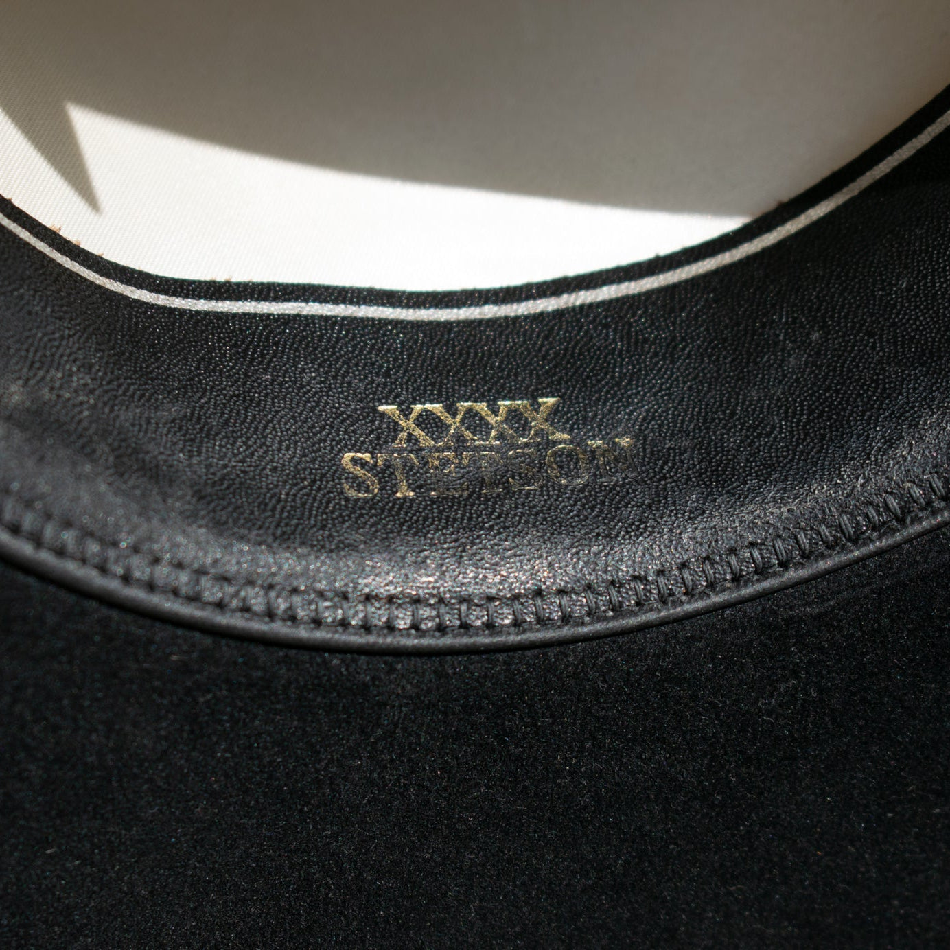 Black XXXX Stetson Cowboy Hat Featuring a Leather Band