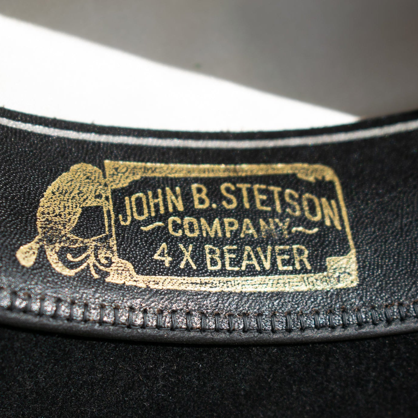 Black XXXX Stetson Cowboy Hat Featuring a Leather Band