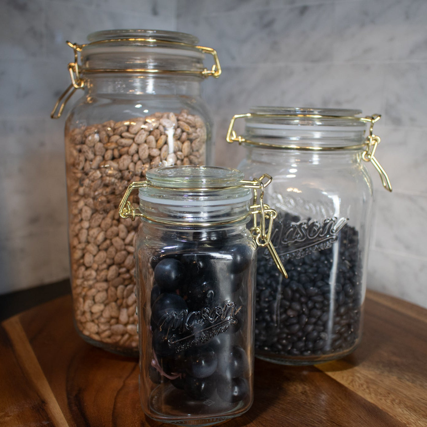 Mason Jar with gold clamp on lid