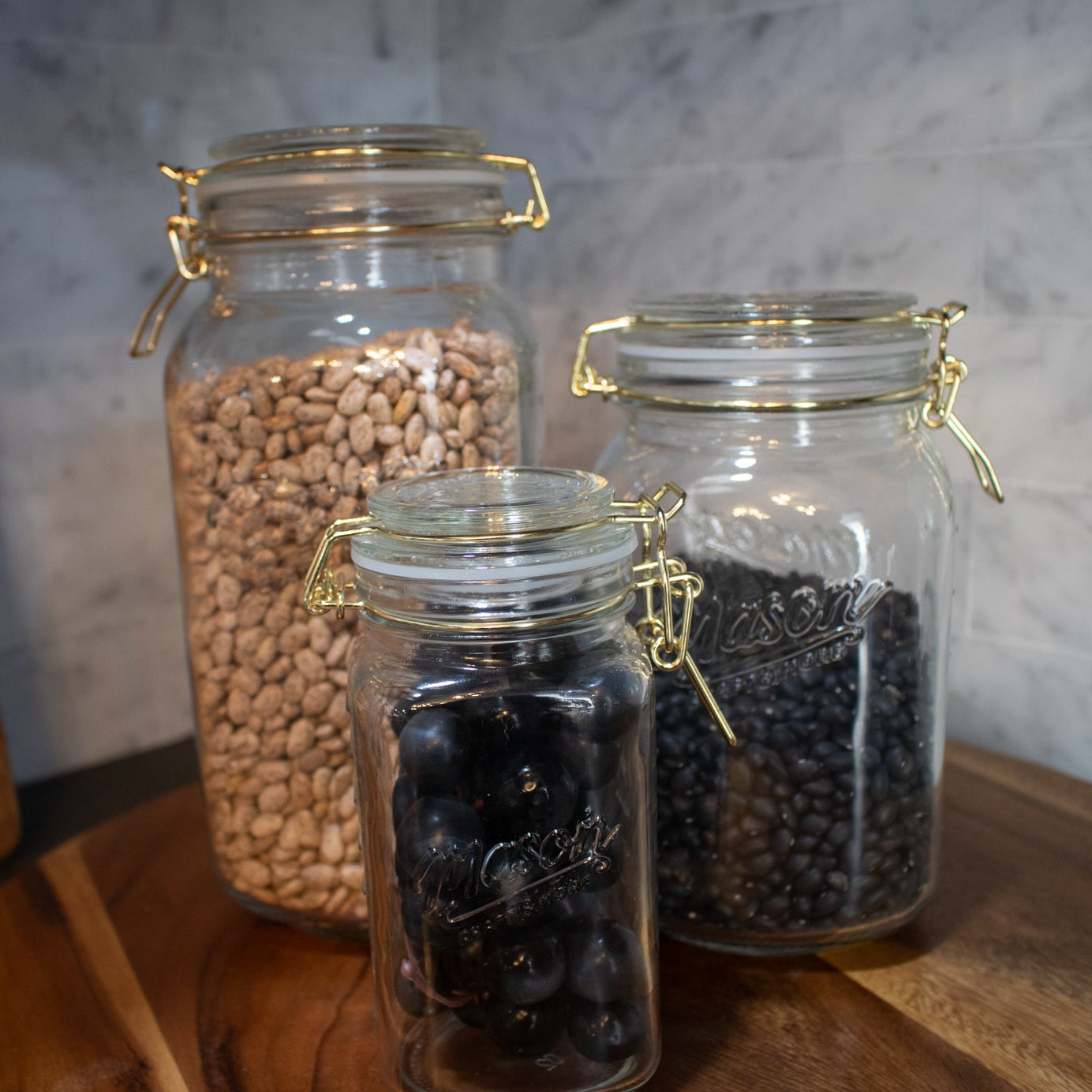 Mason Jar with gold clamp on lid