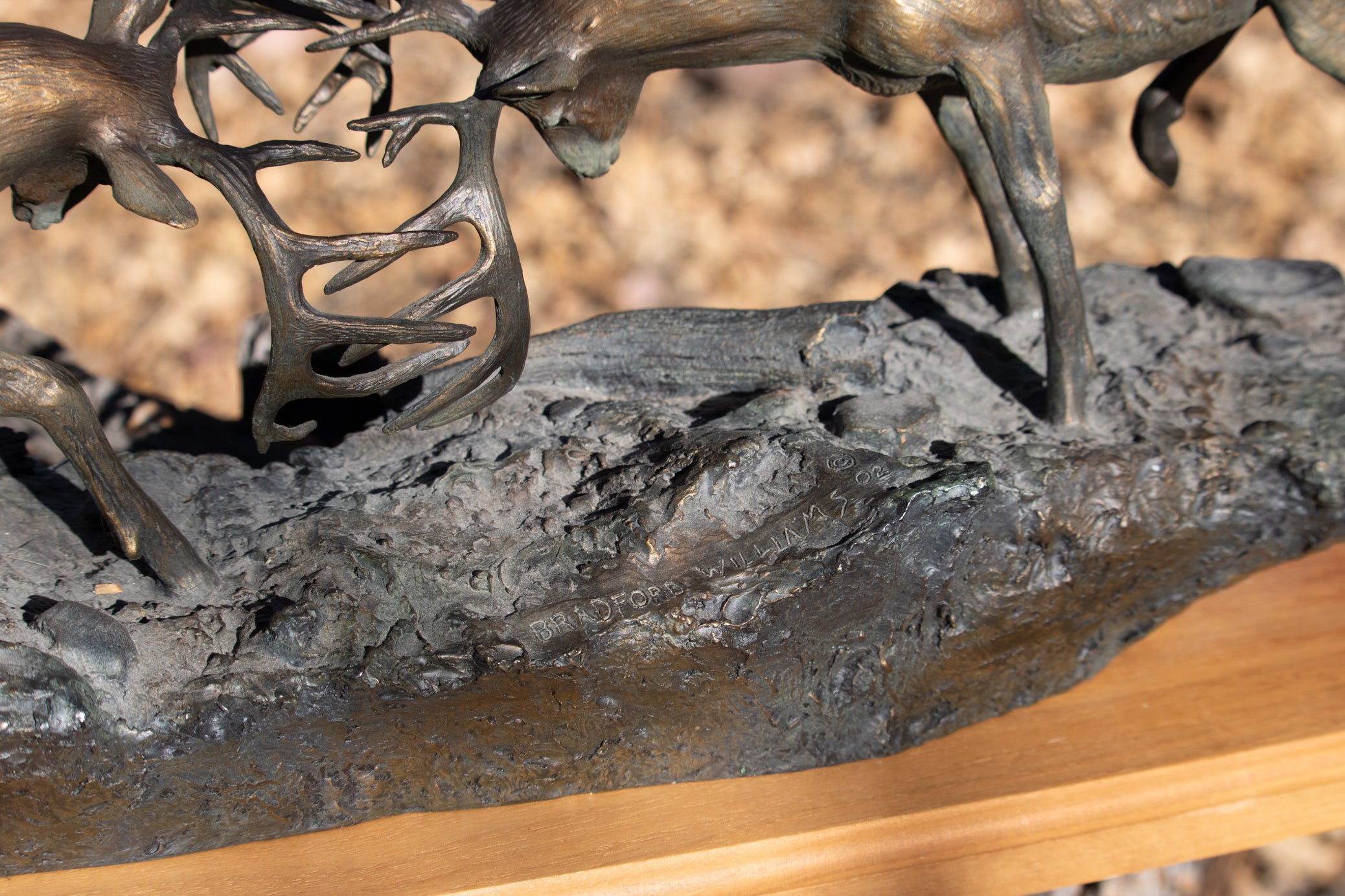 "Dominance II" By Bradford Williams 85/ 1950. Bronze sculpture depicts two fighting whitetail bucks