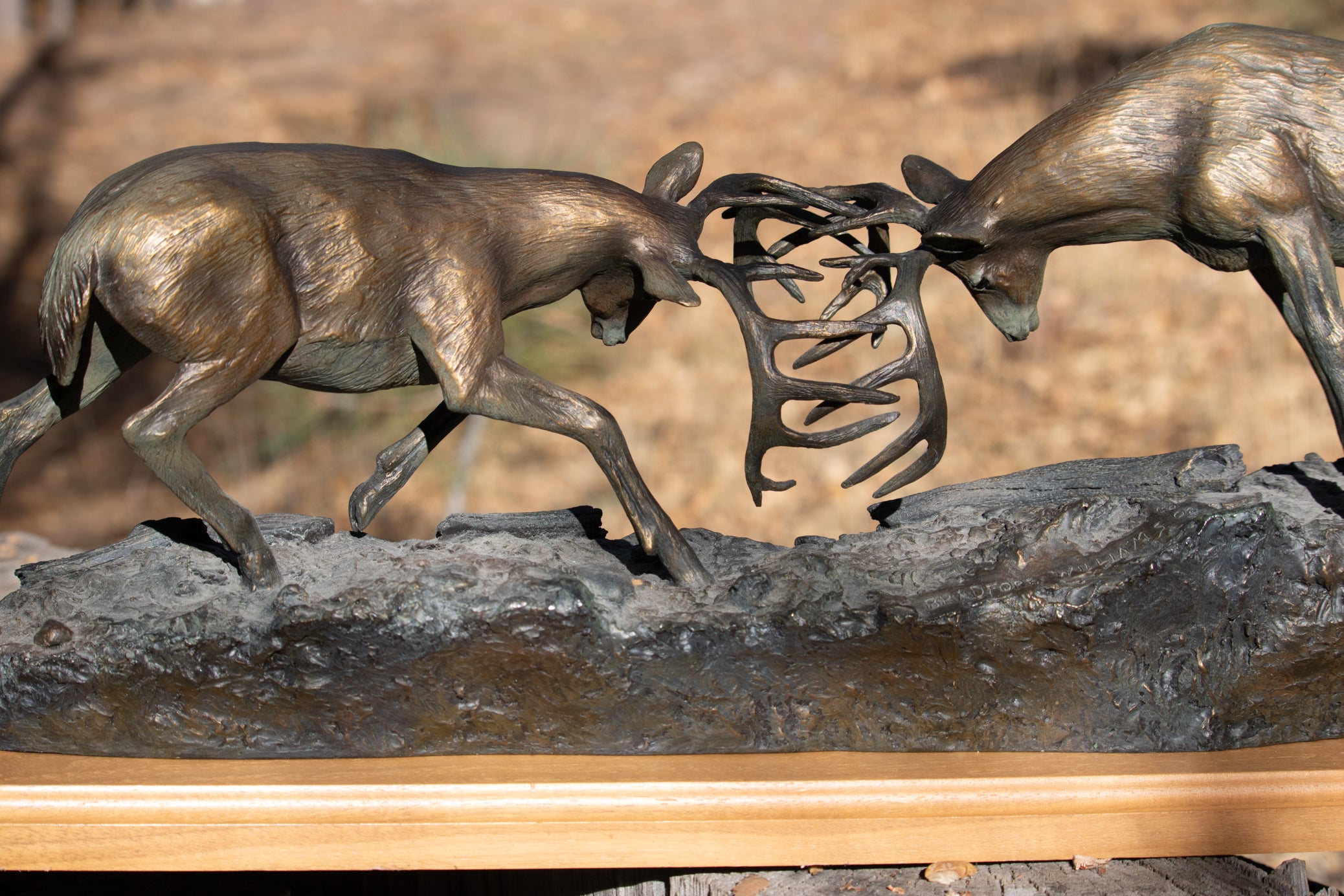 "Dominance II" By Bradford Williams 85/ 1950. Bronze sculpture depicts two fighting whitetail bucks