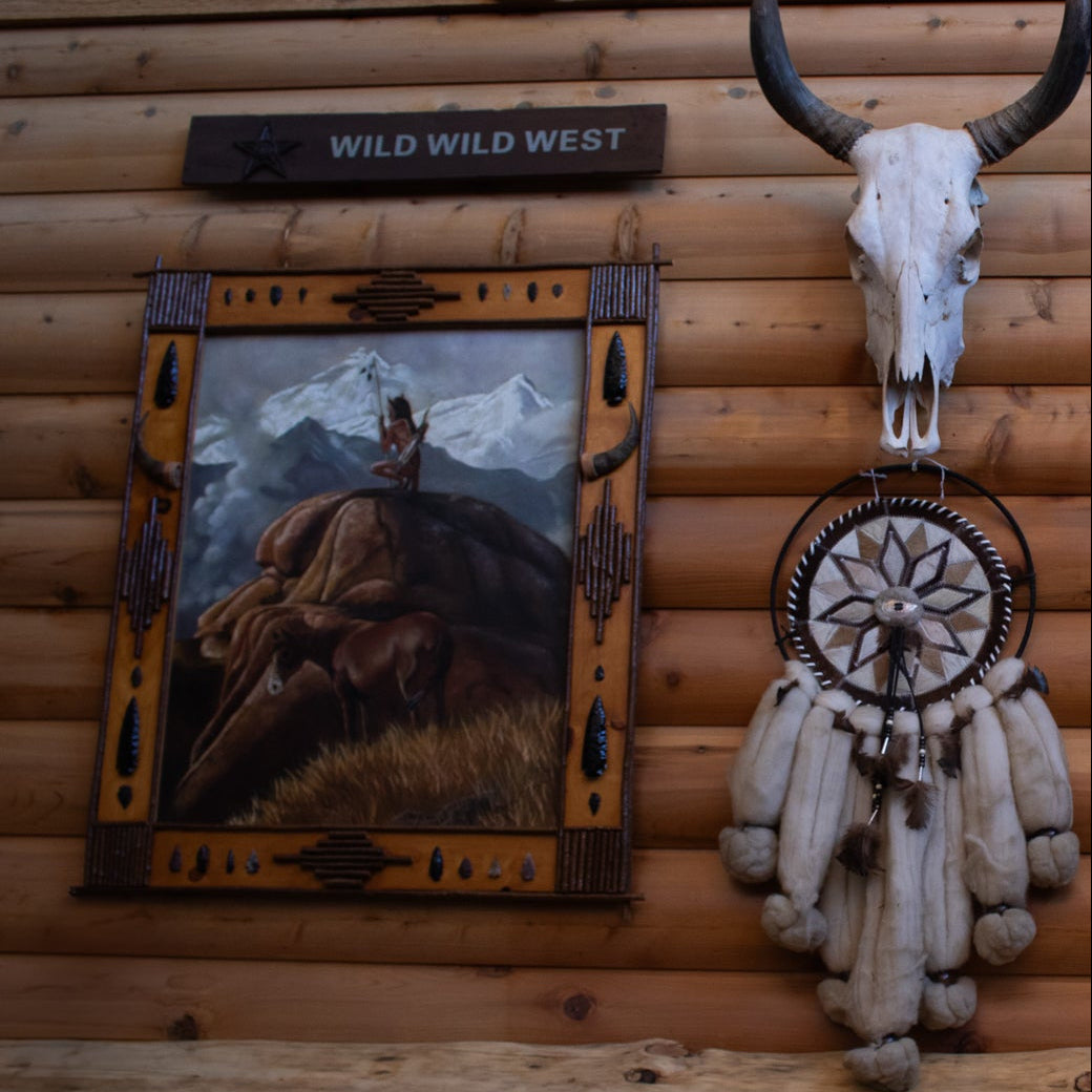 original Shirley C Capra oil painting featuring Navajo Indian warrior and horse in handcrafted rustic wooden frame with arrowheads antlers feathers and natural stone accents