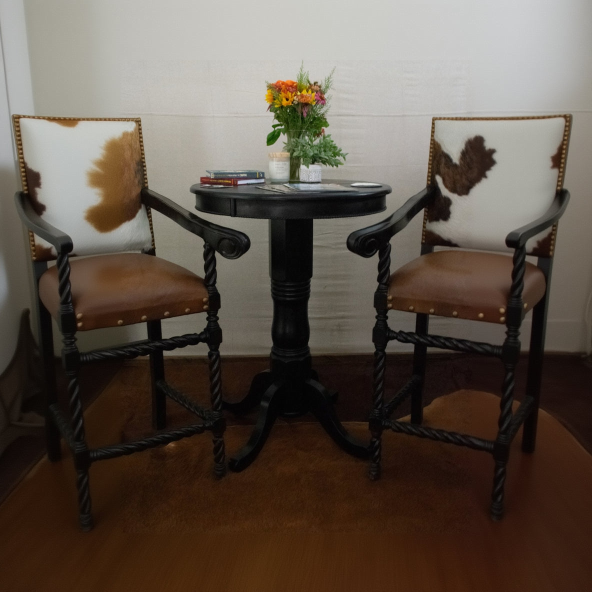 rustic black round pub height pedestal table with carved base and 30 inch round top farmhouse lodge furniture decor