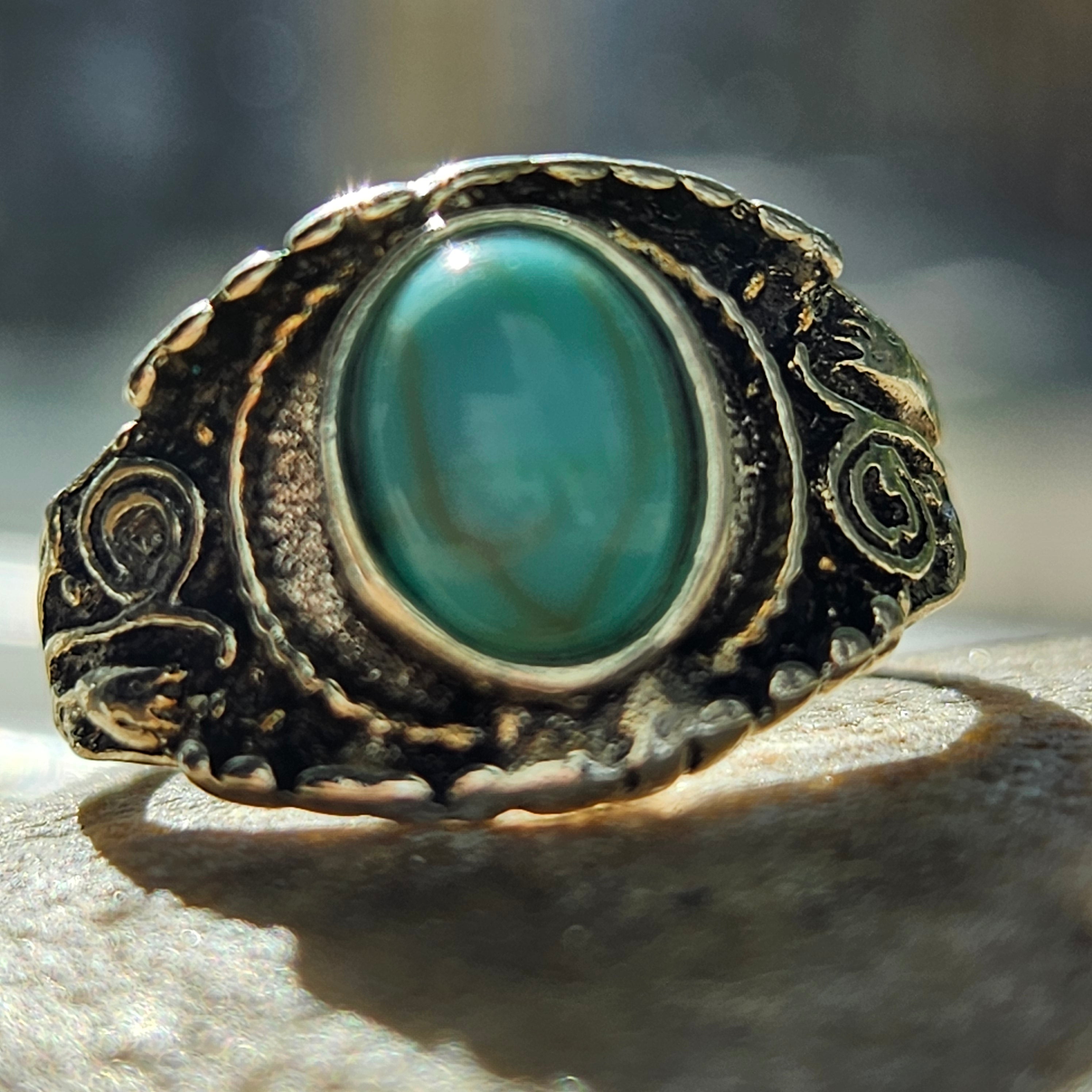 Vintage silver plated statement ring featuring a bright faux turquoise oval stone with ornate Southwestern and boho style engraved detailing, size 7.