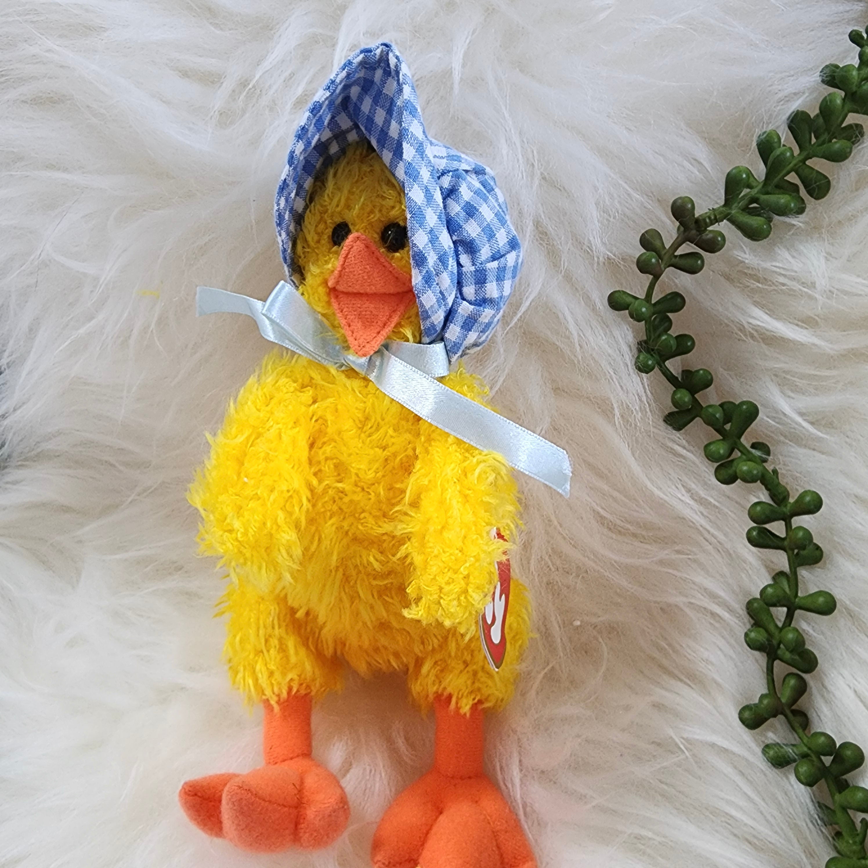 Ty Beanie Babies 'Bonnie the Duck' plush toy with a yellow body, orange beak and feet, wearing a blue and white checkered hat.