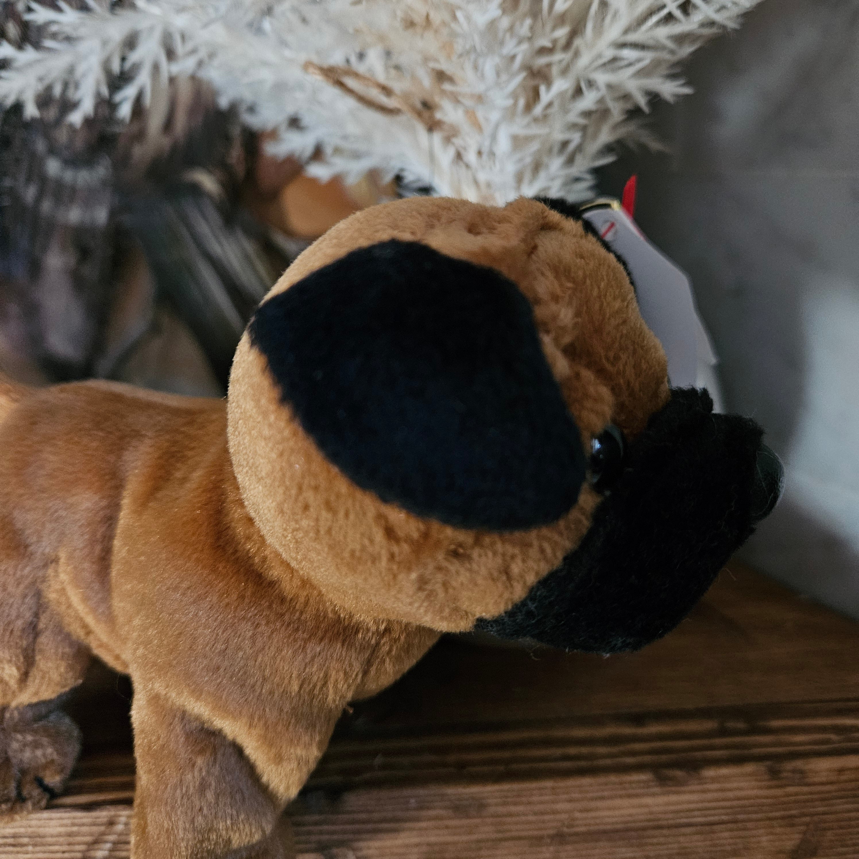 Ty Beanie Babies 'Rootbeer the Dog' is a plush toy with soft brown fur and black ears, designed to look like a playful dog.