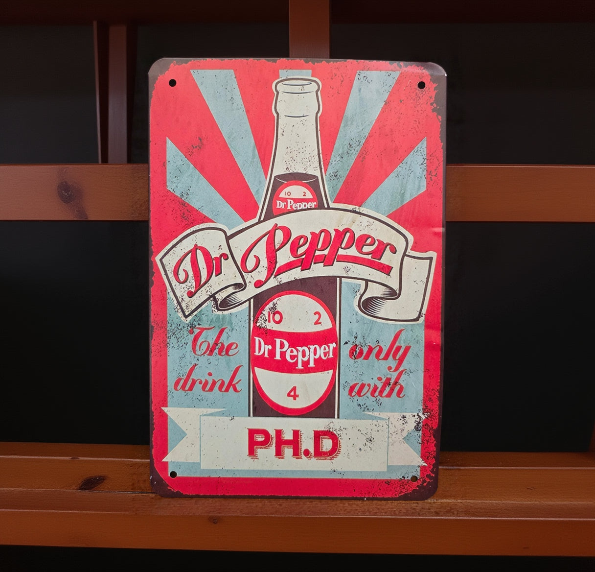 Vintage-style metal advertisement tin sign featuring retro Americana, automotive, gasoline, soda, and garage-themed artwork with distressed classic graphics and nostalgic decor styling.