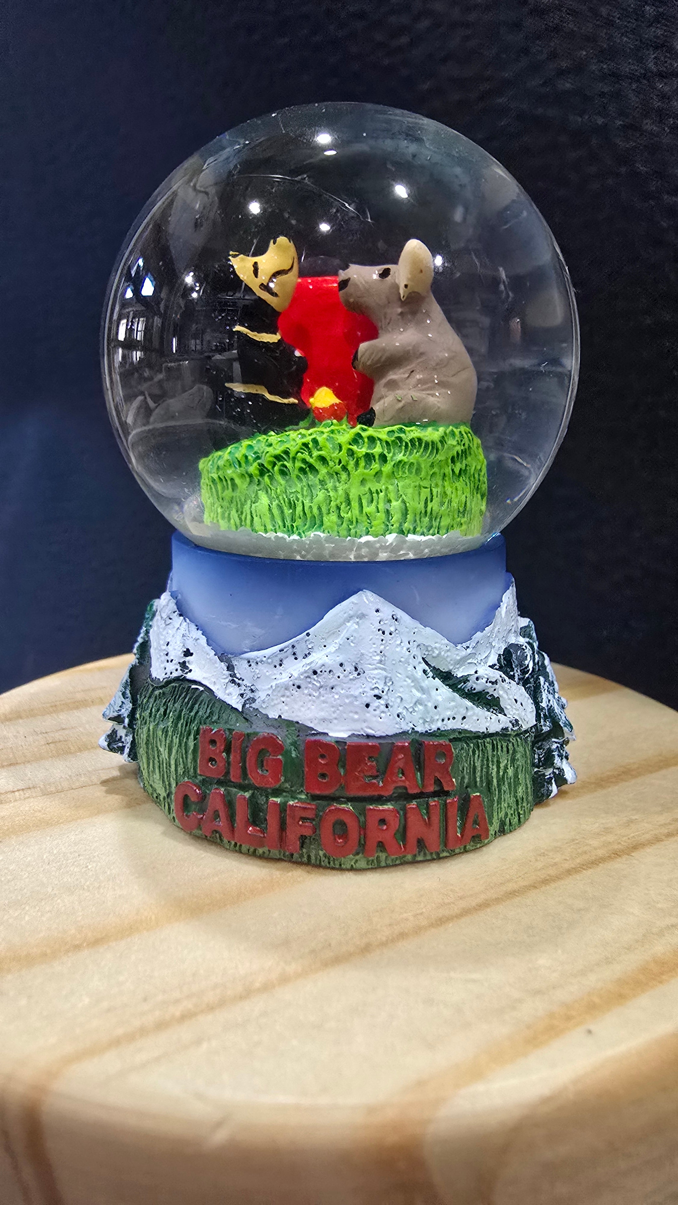 small big bear california snow globe with bear campfire scene and mountain themed base measuring 2.5 inches tall