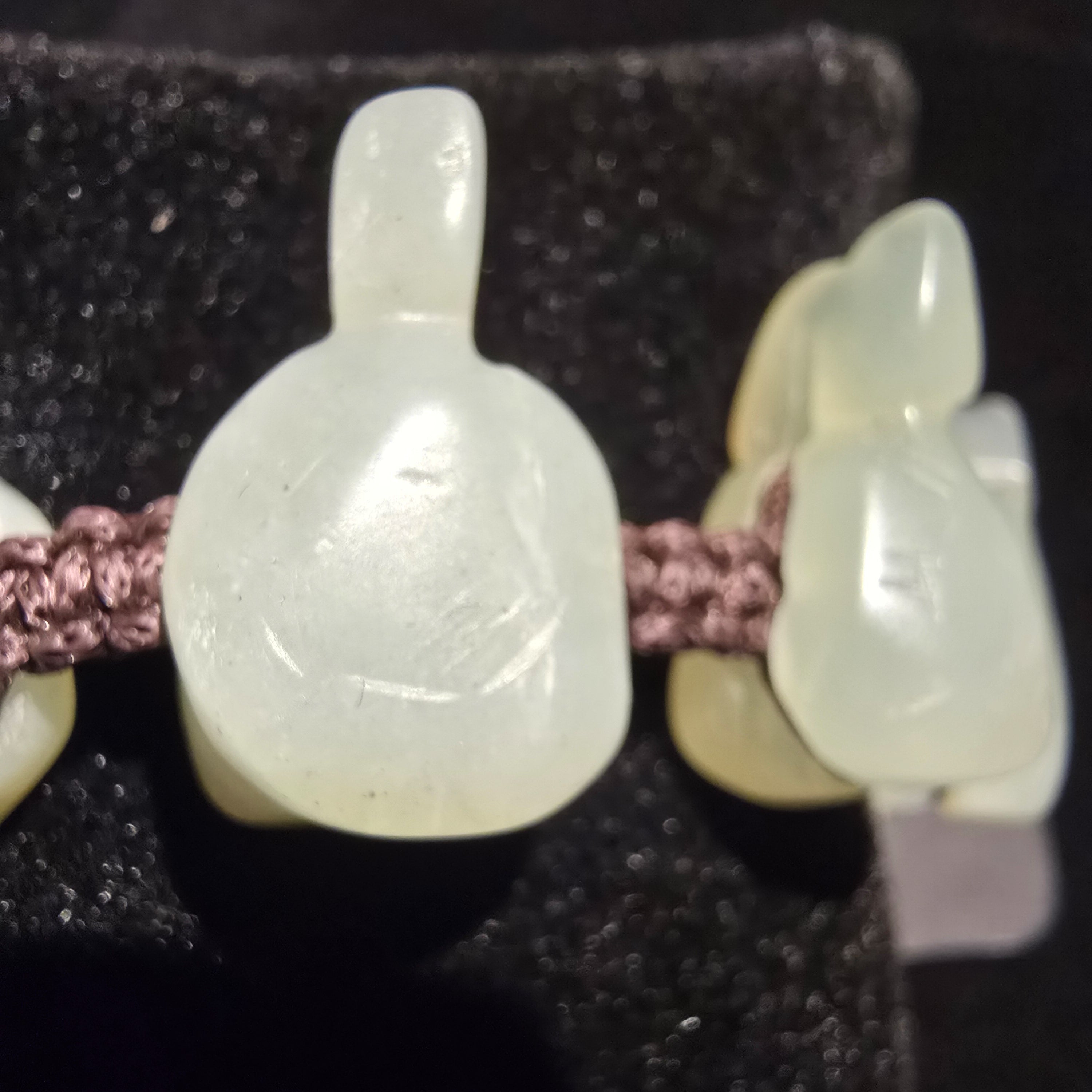 natural jade turtle charm bracelet with hand carved jade beads on adjustable woven cord symbolic Chinese luck jewelry