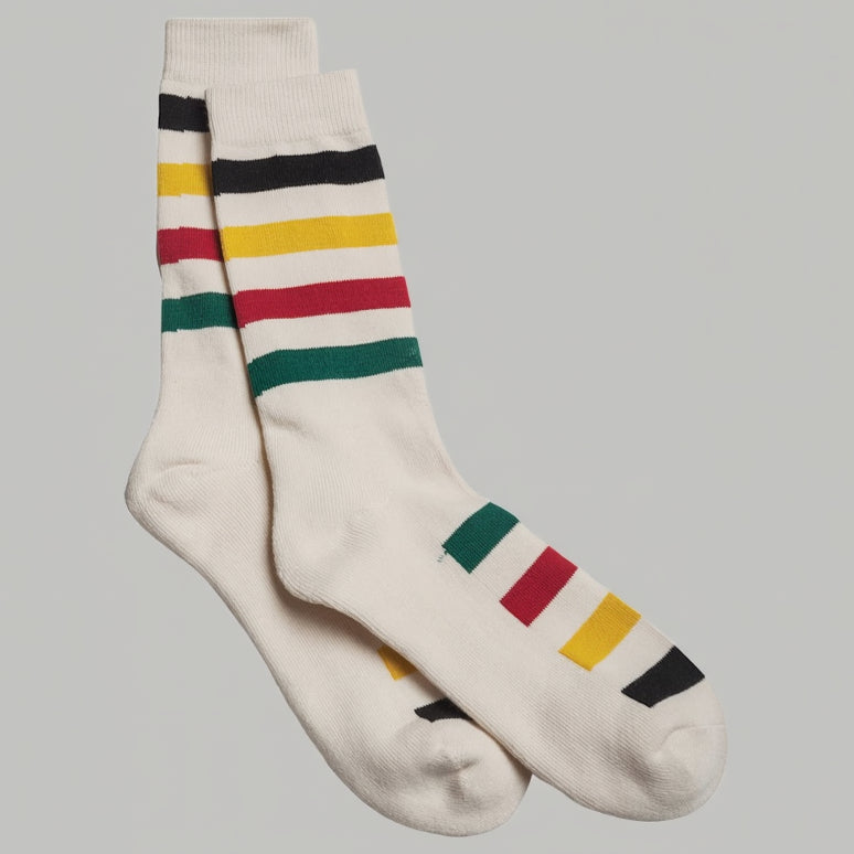 A pair of Pendelton National Park stripe crew socks with multiple colors including white, red, green, and yellow stripes.