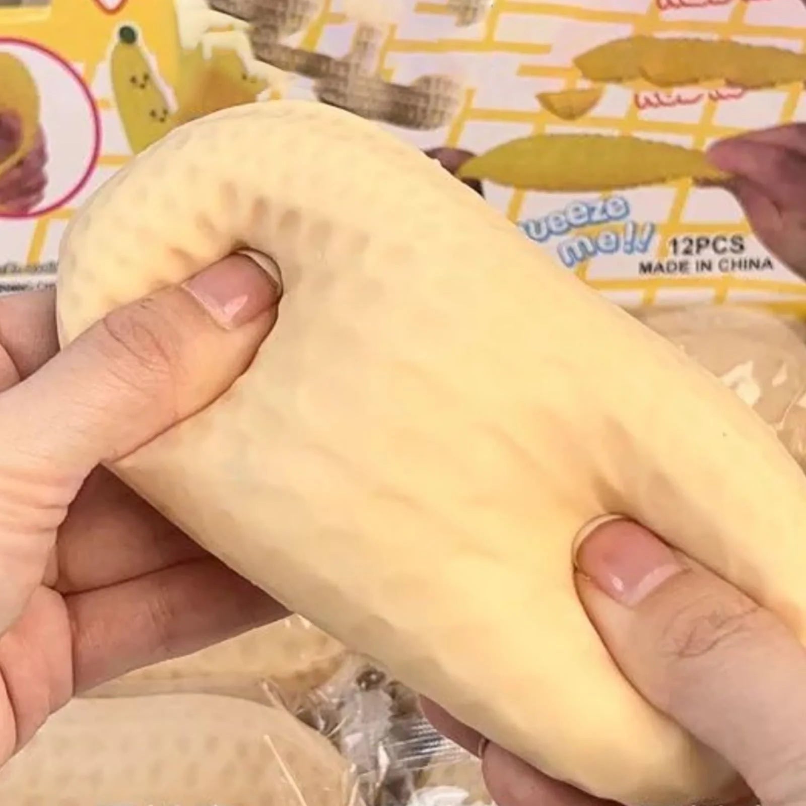 Realistic peanut-shaped slow-rise squishy toy measuring approximately 4.1 inches long, designed for stress relief, sensory play, and fidgeting.