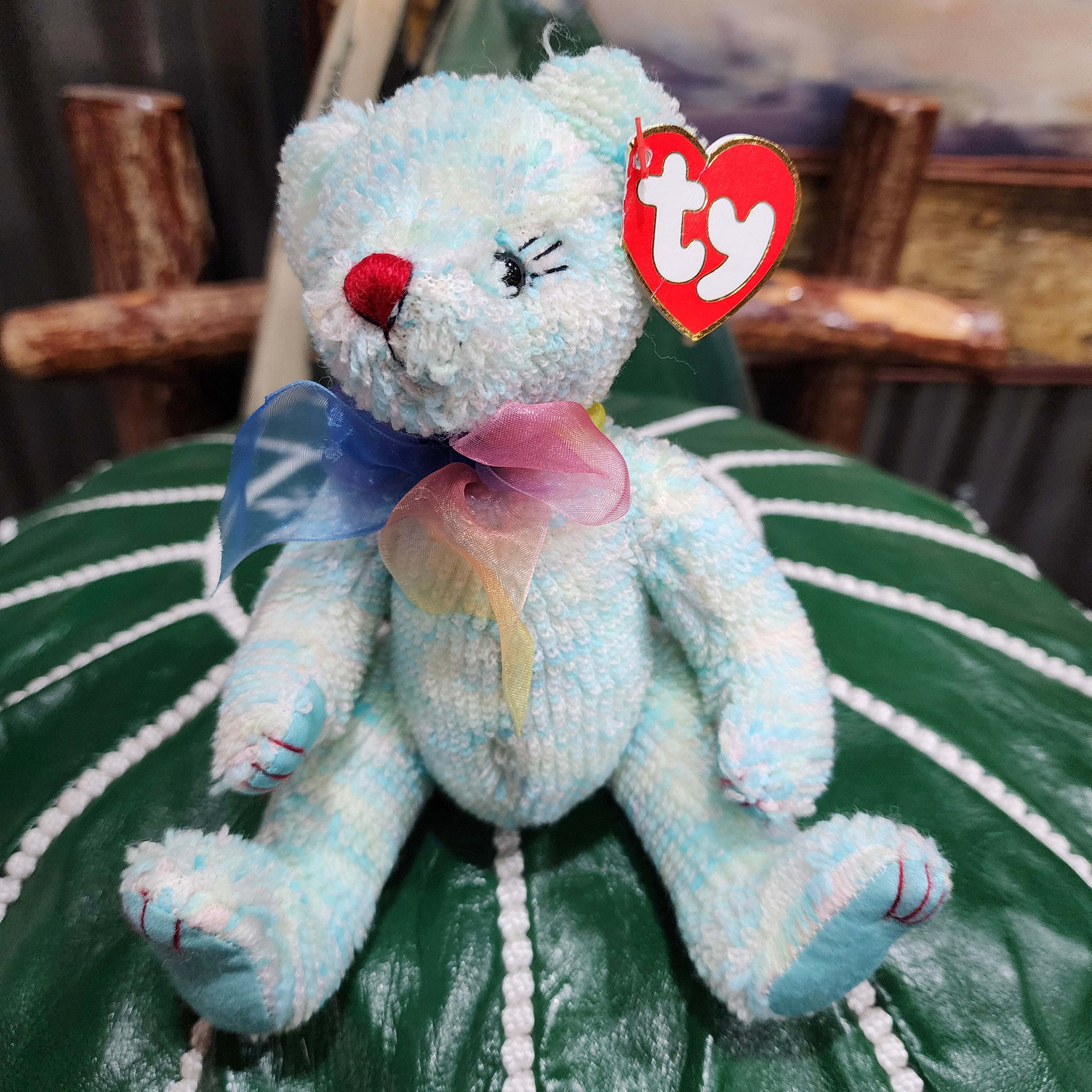 Ty Beanie Babies 'Elizabeth the Bear', a plush bear with a blue and pink bow around its neck