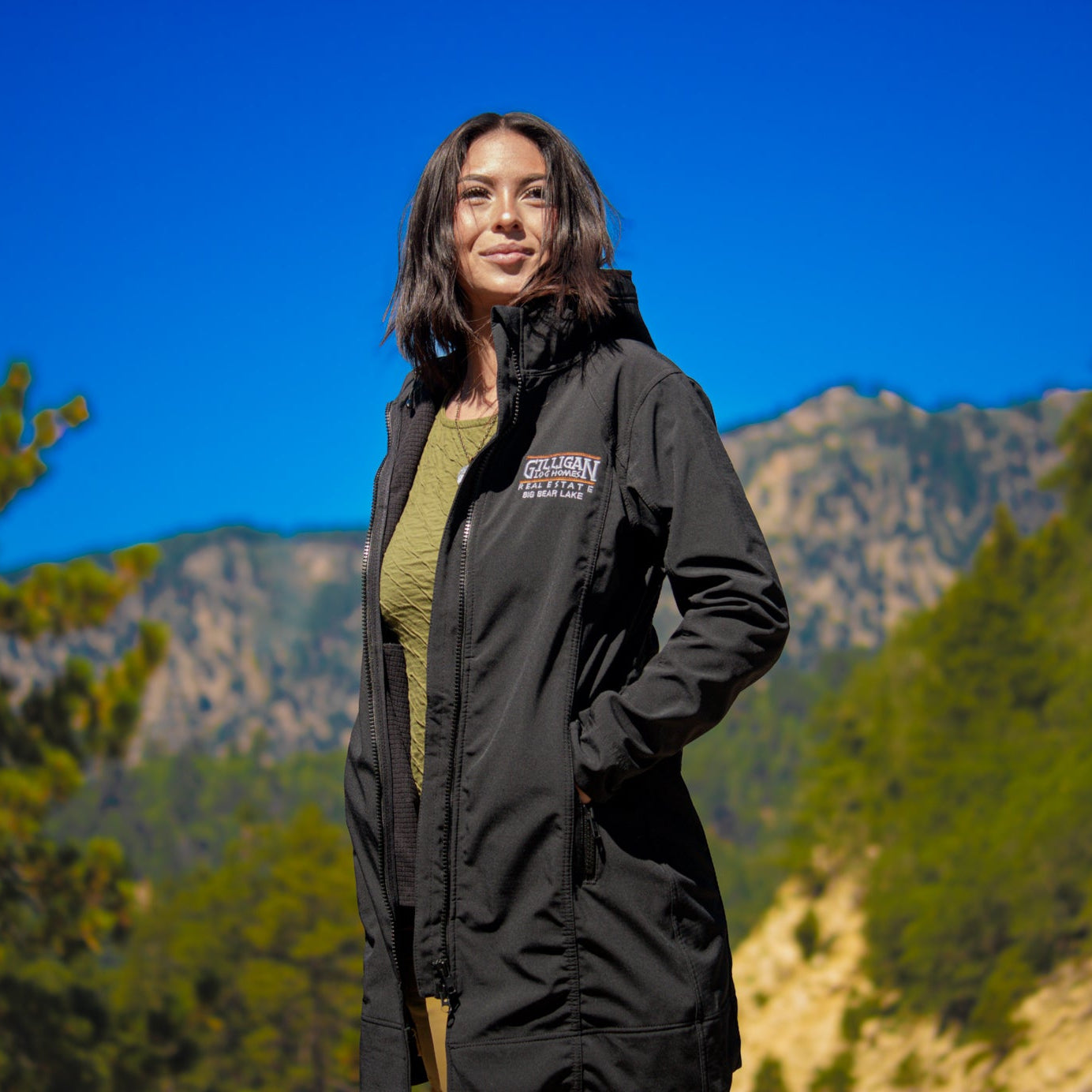 Port Authority Women's Black Active Hooded Rain Jacket with "Gilligan Log Homes Real Estate Big Bear Lake" logo
