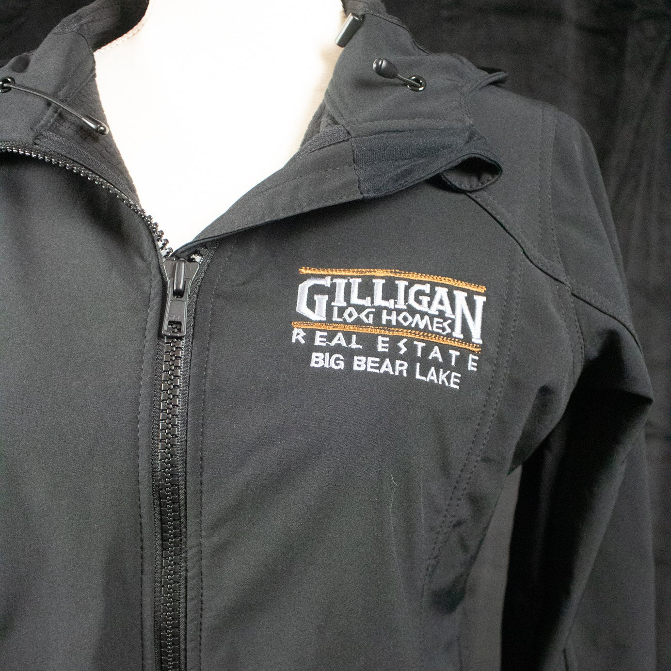 Port Authority Women's Black Active Hooded Rain Jacket with "Gilligan Log Homes Real Estate Big Bear Lake" logo